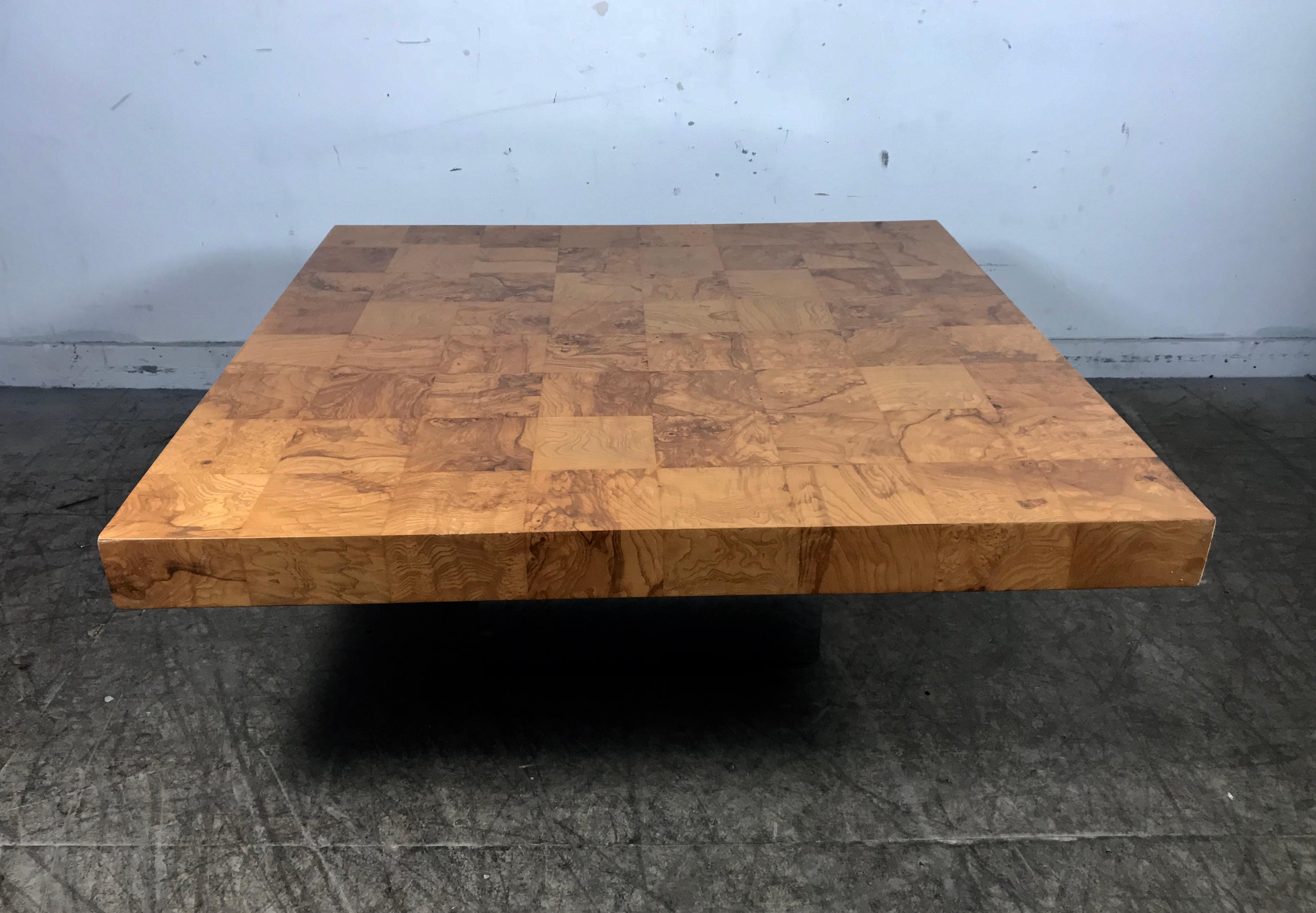 Classic burl wood and chrome cocktail coffee table designed by Milo Baughman for Thayer Coggin. Beautiful burl olivewood parquet patchwork top. Square mirrored chrome base, stunning, timeless. Hand delivery avail to New York City or anywhere en