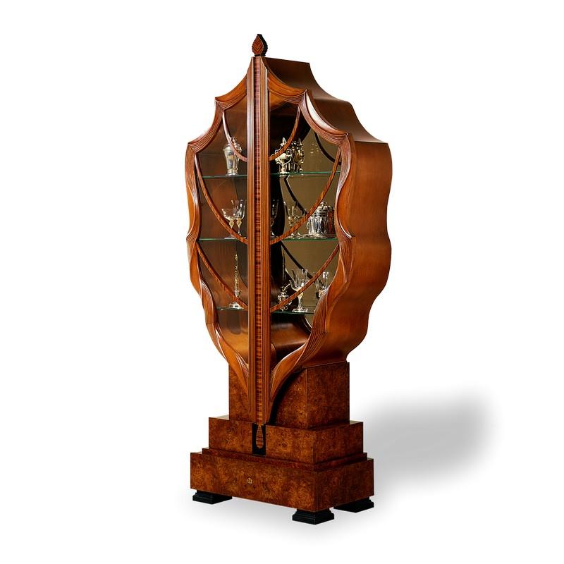This piece is a true artistic sculpture. The doors are in solid wood and modelled like a real leaf. Also the stump-base in elm briar is an unparalleled symbol of the tree. On request, inside lighting.