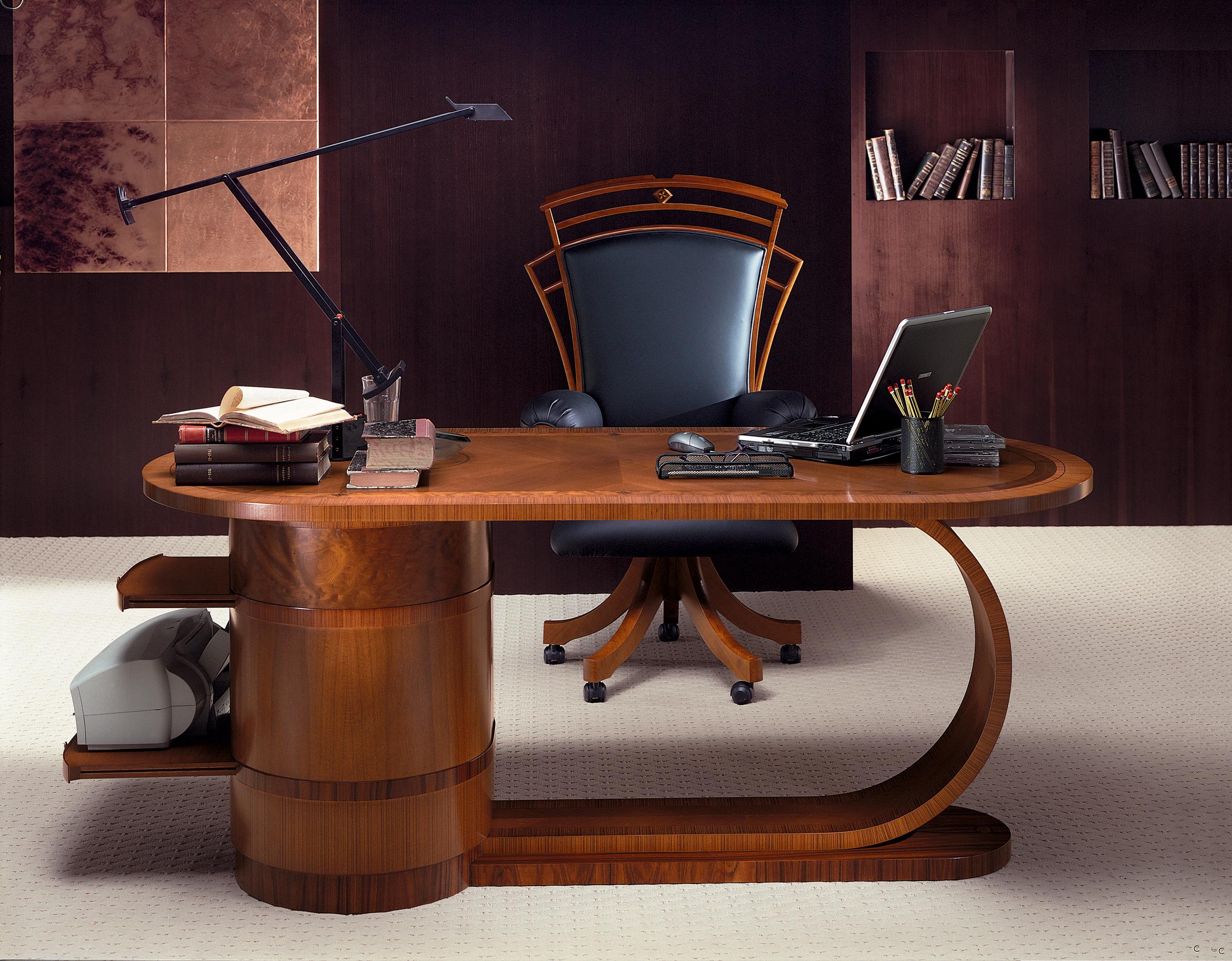The structure of this elegant writing desk is solid wood plated with cherry-wood, zebrano, briar-wood and other precious woods. In the cylindrical body there are 4 wide drawers with 2 extractable, invisible shelves (they are enclosed in the
