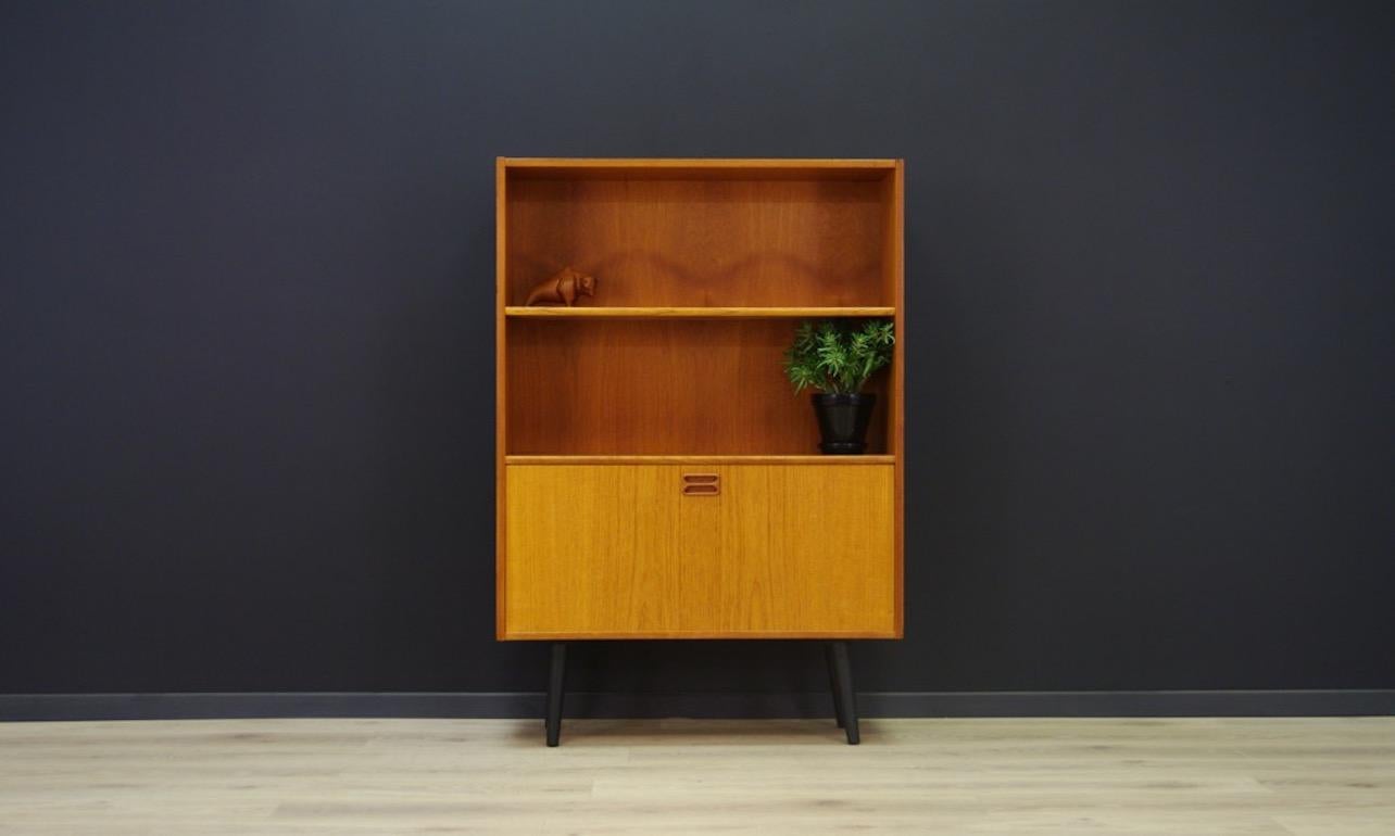 Practical cabinet, bookcase from 1960s-1970s - Danish design, teak veneer surface. A spacious bar with a shelf and compartments. Preserved in good condition (minor scratches and dings, filled veneer loss) - directly for use.

Dimensions: height