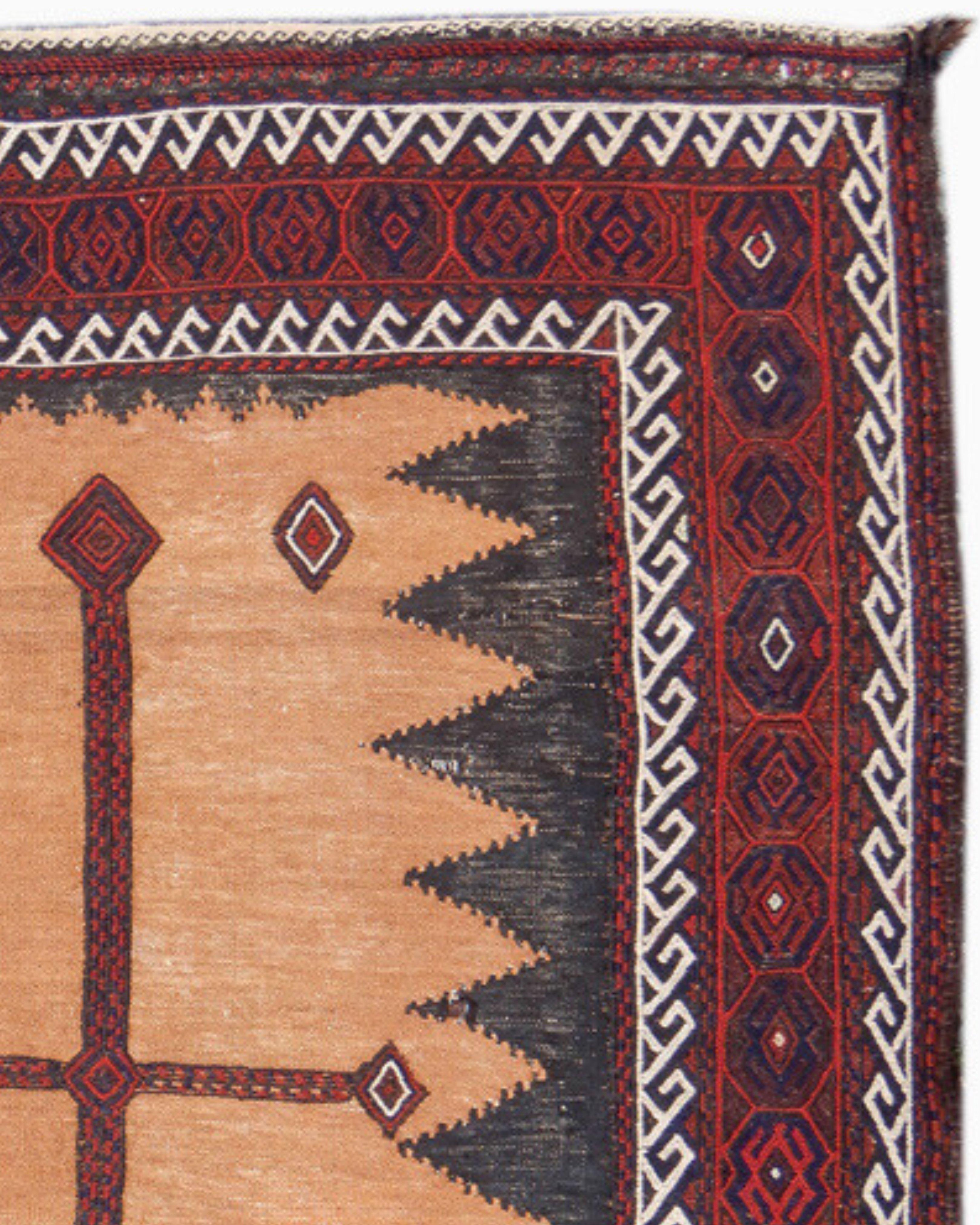 Classic Camel Ground Baluch Soffreh Rug, c. 1900

This classic camel ground ‘soffreh,’ or presentation cloth, is the work of Baluch weavers from the Khorosan province in eastern Persia. The field is comprised of slit tapestry weave with a solitary