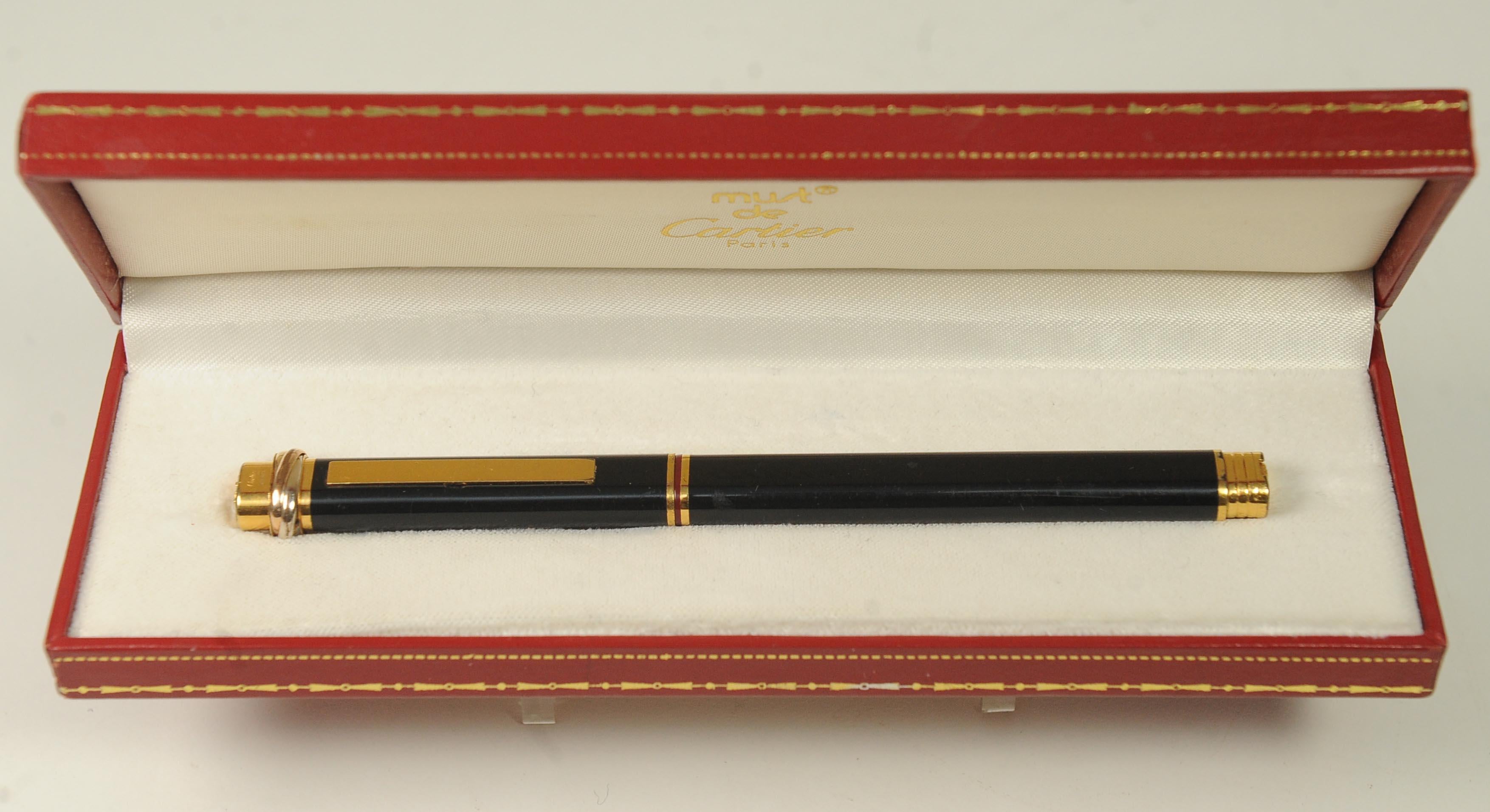 Elegant Vintage Cartier 18ct Gold Plated & Black Vendome Trinity Oval Rollerball Pen Made in Paris, France

Item Is Sold With Original Red & Gold Leather Box.
