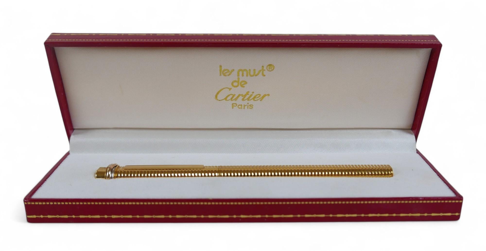 Elegant Vintage Cartier 18ct Gold Plated Vendome Trinity Oval Rollerball Pen Made in Paris, France

Item Is Sold With Original Red & Gold Leather Box, Red & Gold Leather.

Cartier pens are designed by Cartier, & are manufactured by Montblanc. This