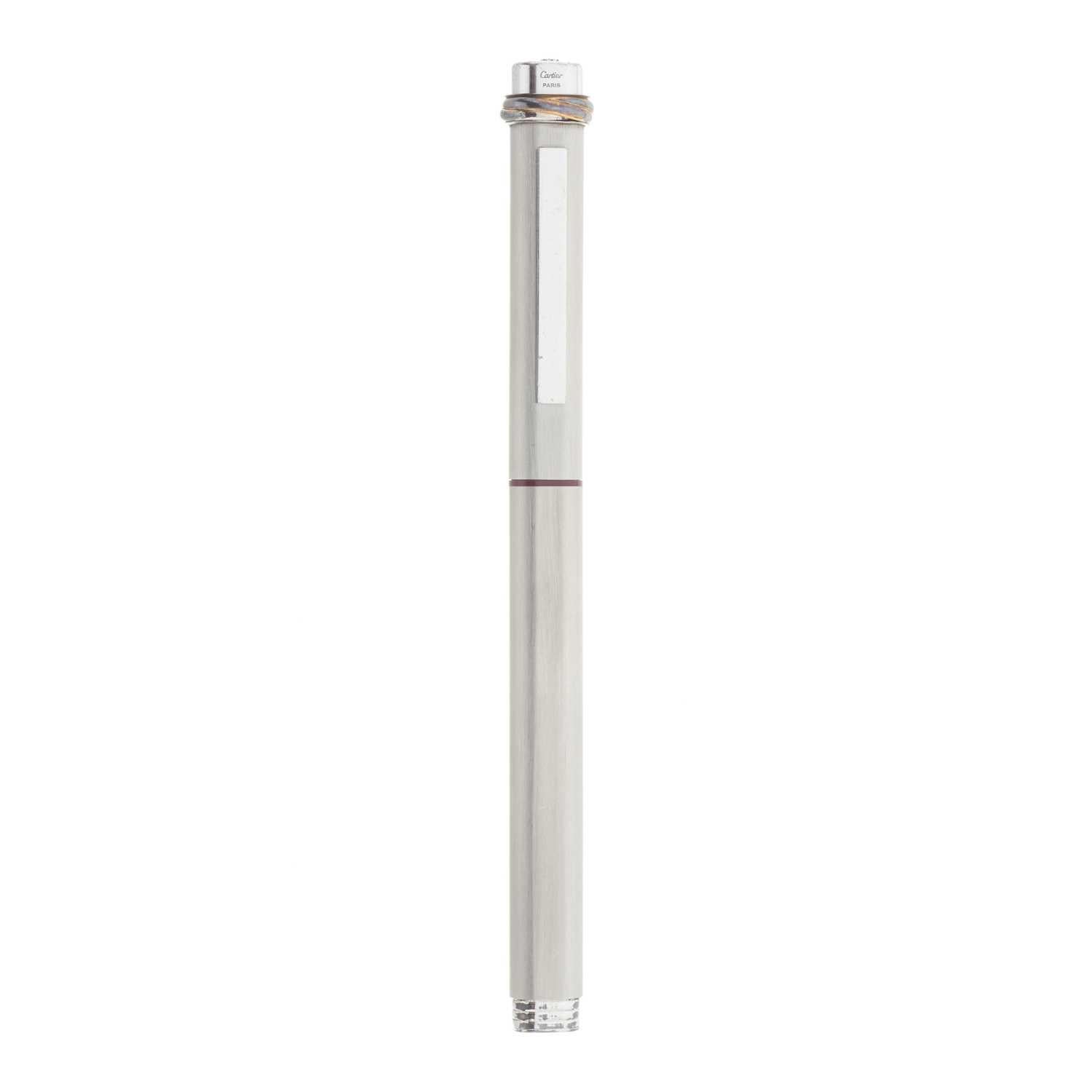 Cartier Vendome Trinity Brushed Ballpoint Pen With Bordeaux Leather Slip Case

Brushed Silver-tone with Trinity rings to the cap, and a retractable mechanical clip, together with the maker's Bordeaux leather pouch.

There are Trinity rings on the