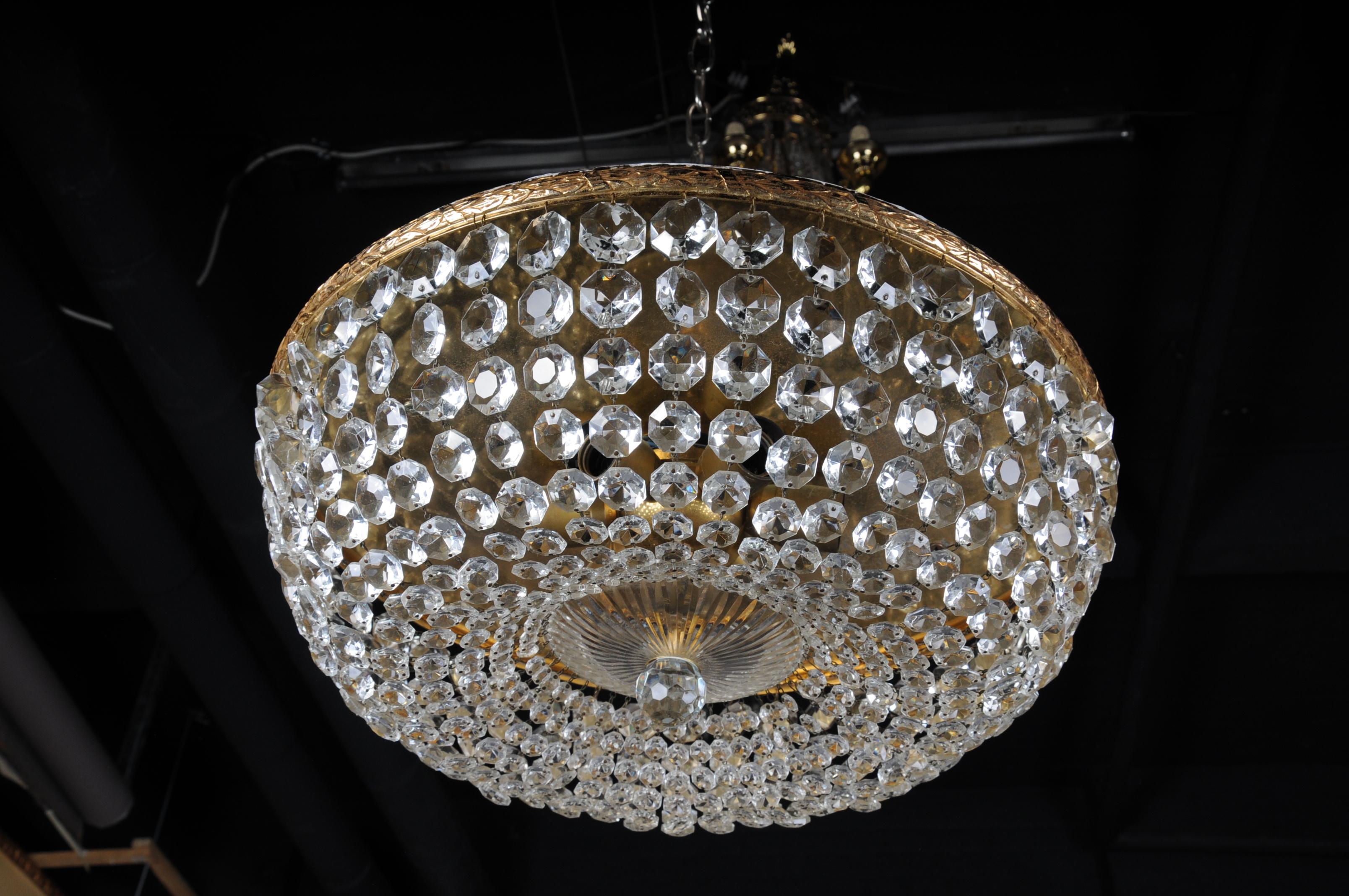 Classic, round ceiling lamp with crystal hangings. Polished brass plate. Extremely high quality workmanship.

(F-100).