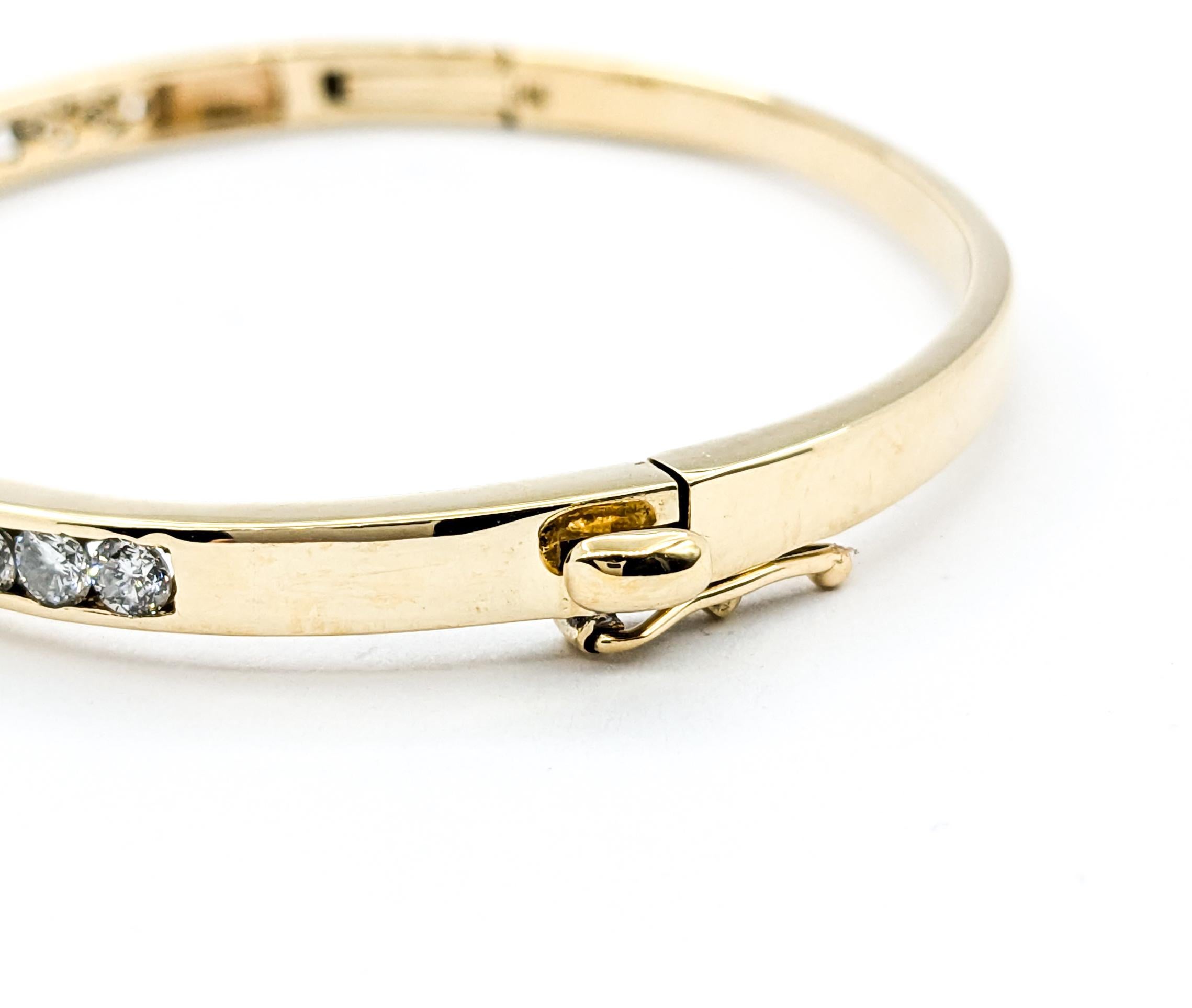 Round Cut Classic Channel Set Diamond Hinged Bangle in Yellow Gold
