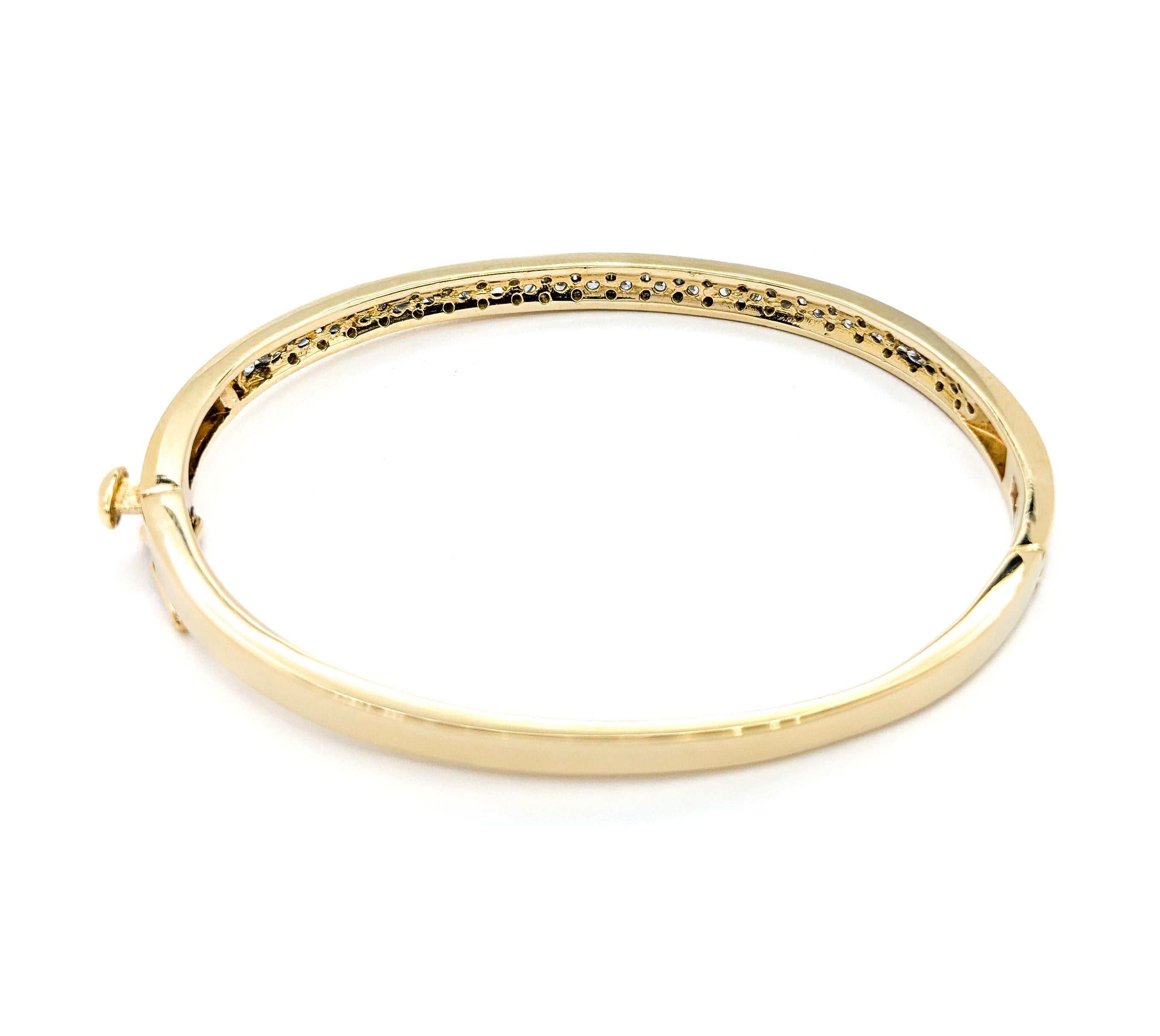 Classic Channel Set Diamond Hinged Bangle in Yellow Gold In Excellent Condition In Bloomington, MN