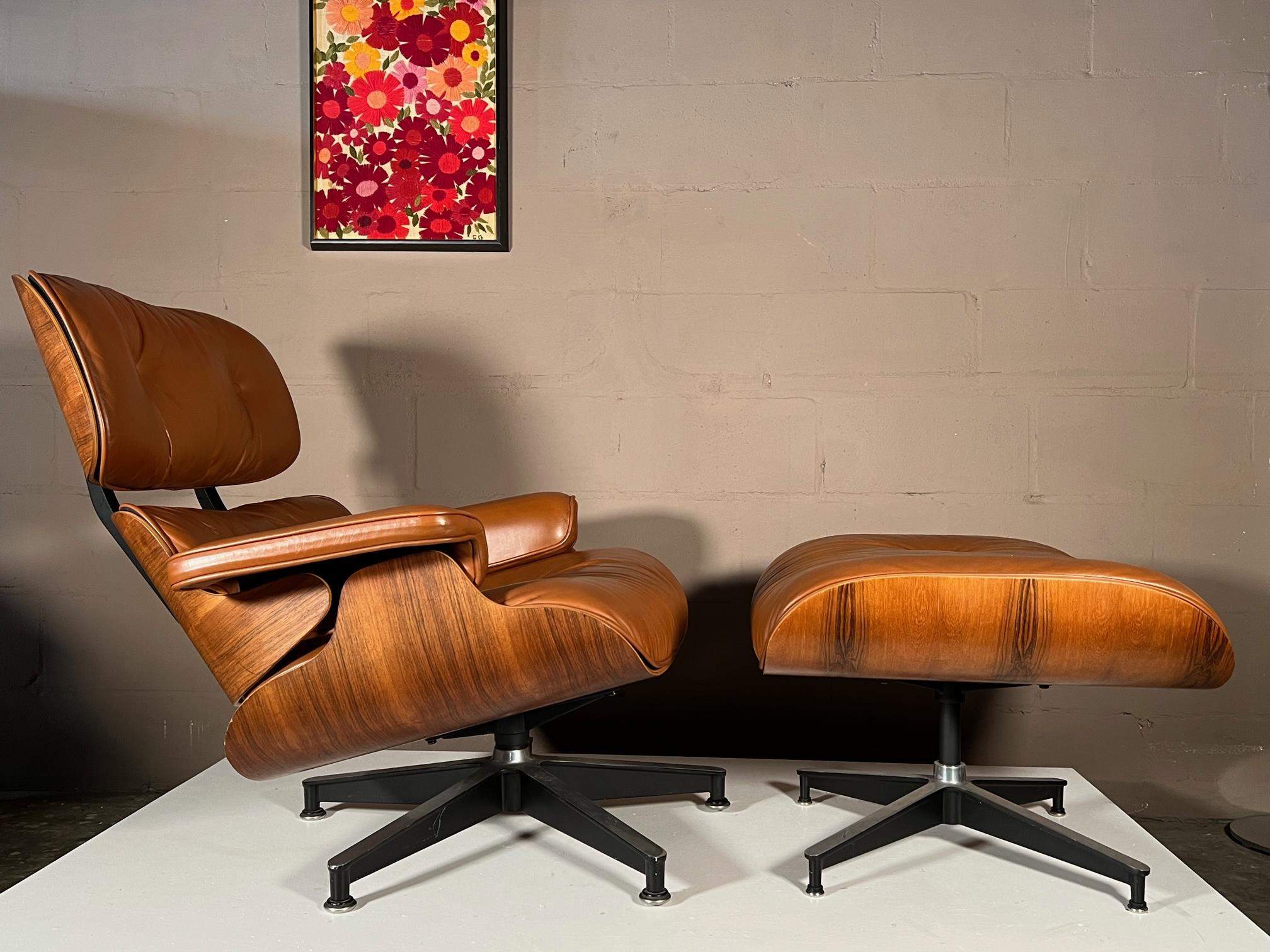Beautiful Charles Eames, Herman Miller lounger chair and ottoman, 1984's. Original cognac brown leather and rosewood with nice graining. The chair has a lightly worn feel with lovely patina. The brown leather has an orange/cognac color.