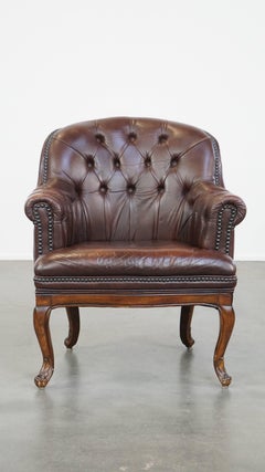 Classic, charming, properly finished cow leather English chesterfield armchair