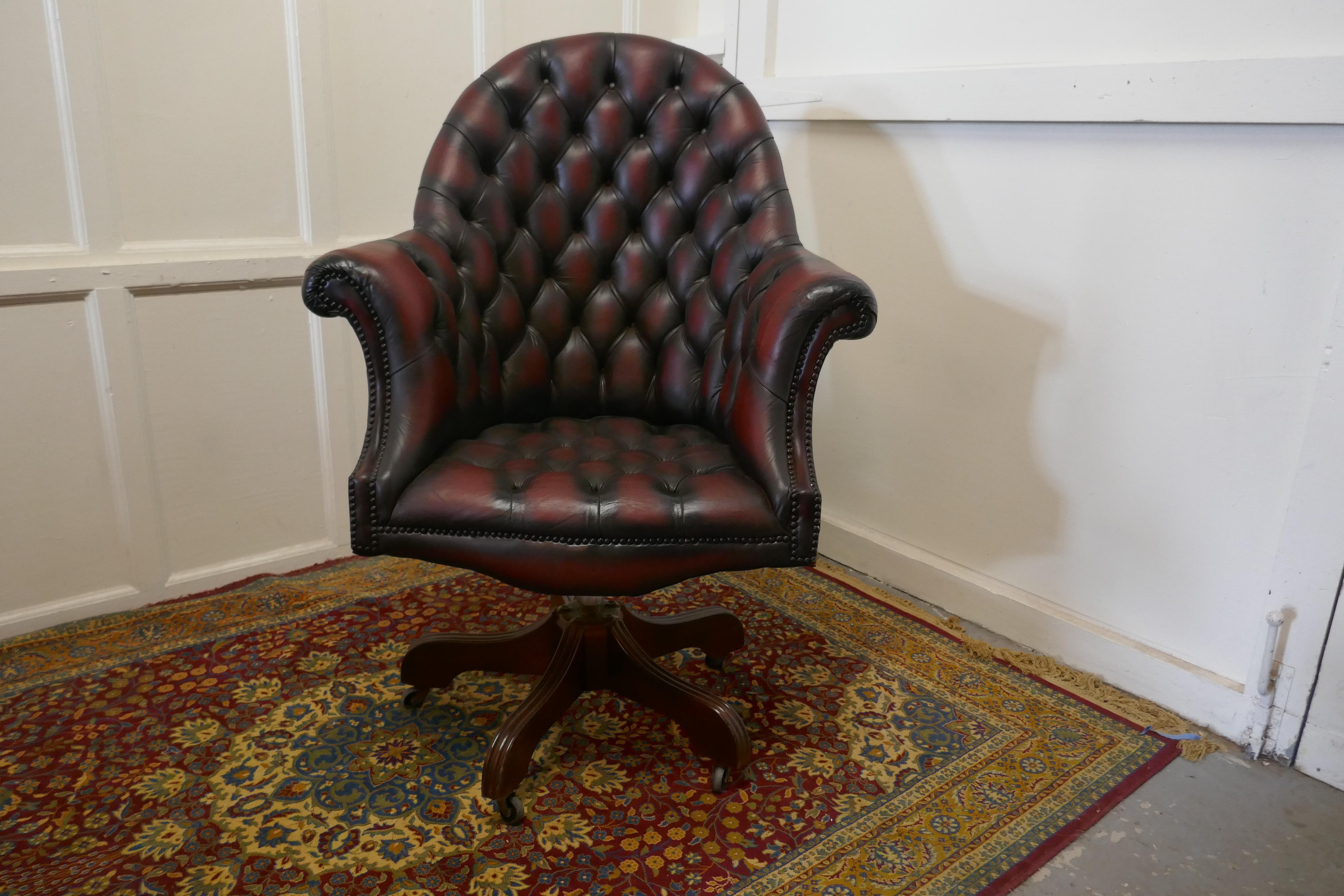 Classic Chesterfield Ox Blood Swivel Office Desk Chair.

This is a classic traditional style piece, swivels and tilts back, it has a sturdy frame 
This is a very roomy and comfortable chair, the chair has a high buttoned back and it curves around