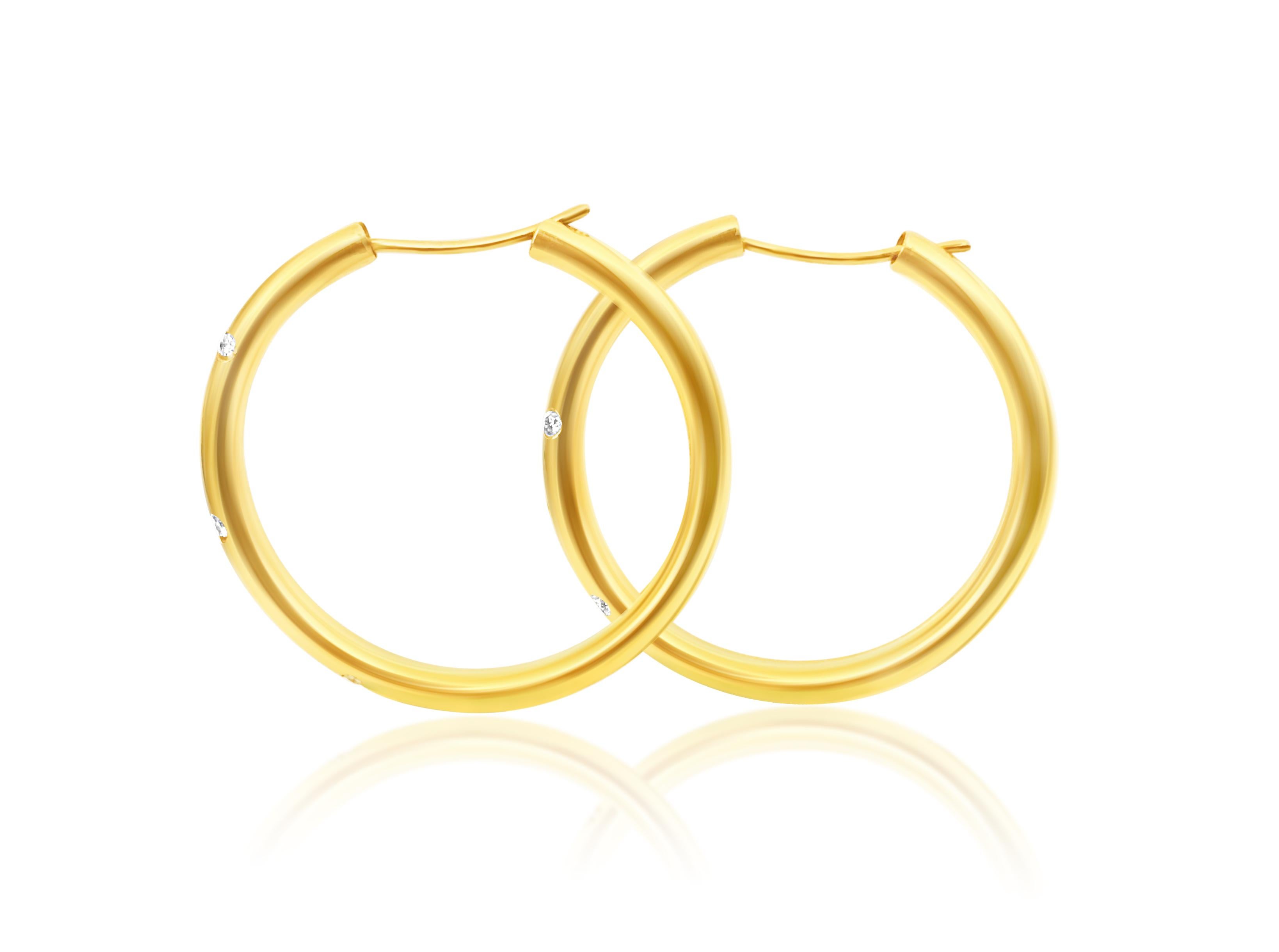 Metal: 18k yellow gold. 

1/3 carat diamonds total. 

VS clarity and G color. 

Round brilliant cut diamonds. 100% natural earth mined and genuine diamonds. 

Gorgeous European style ladies gold and diamond chic hoop earrings. Simple and elegant