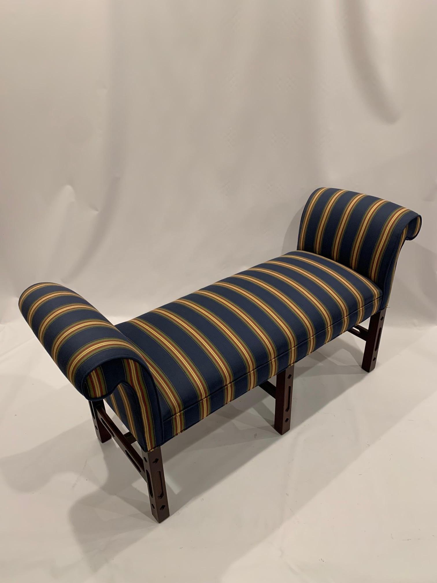 Classic mahogany Chippendale style bench having stylish striped upholstery.