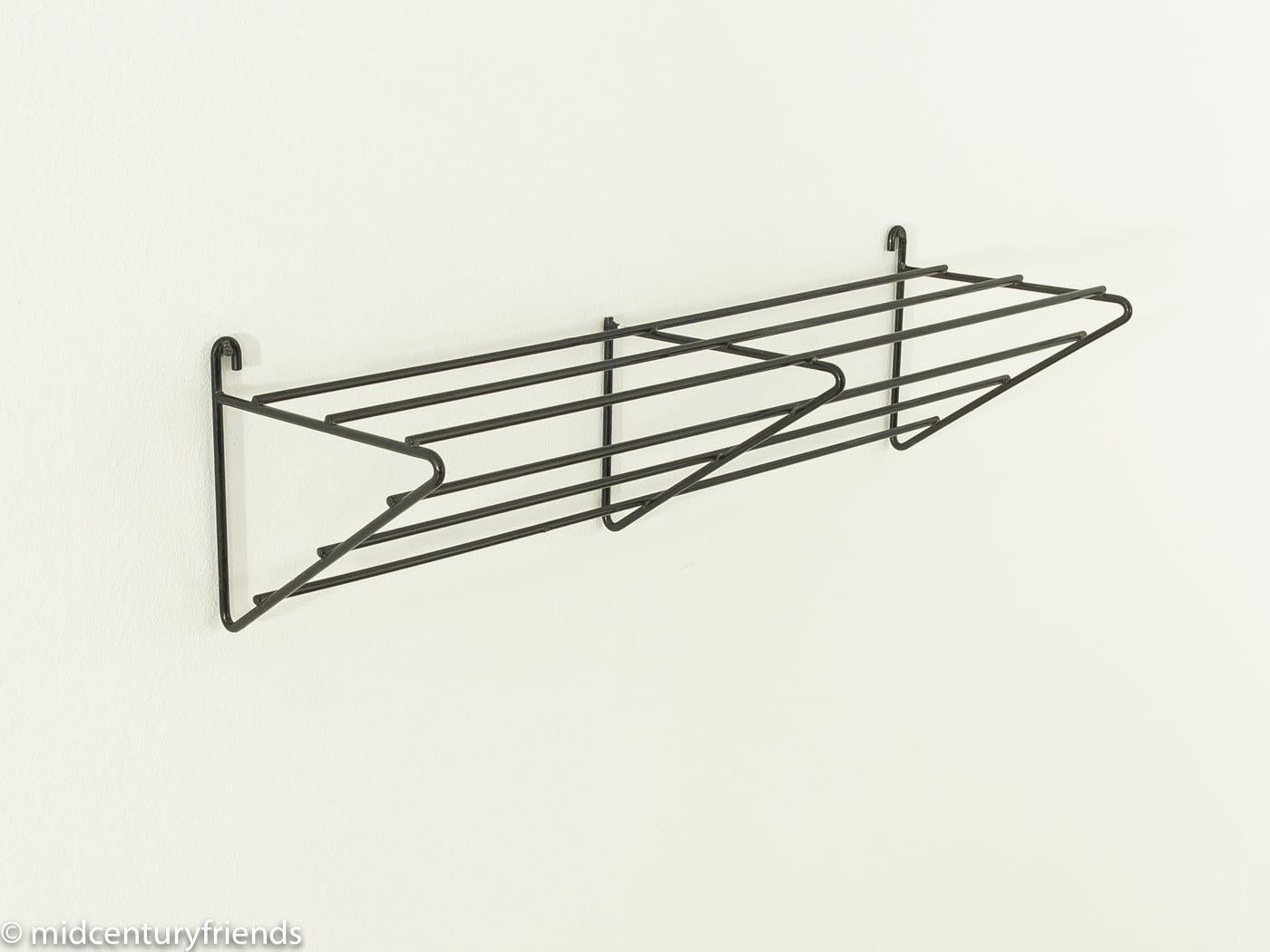 Classic clothes rack from the 1960s. High quality frame made of black lacquered steel.