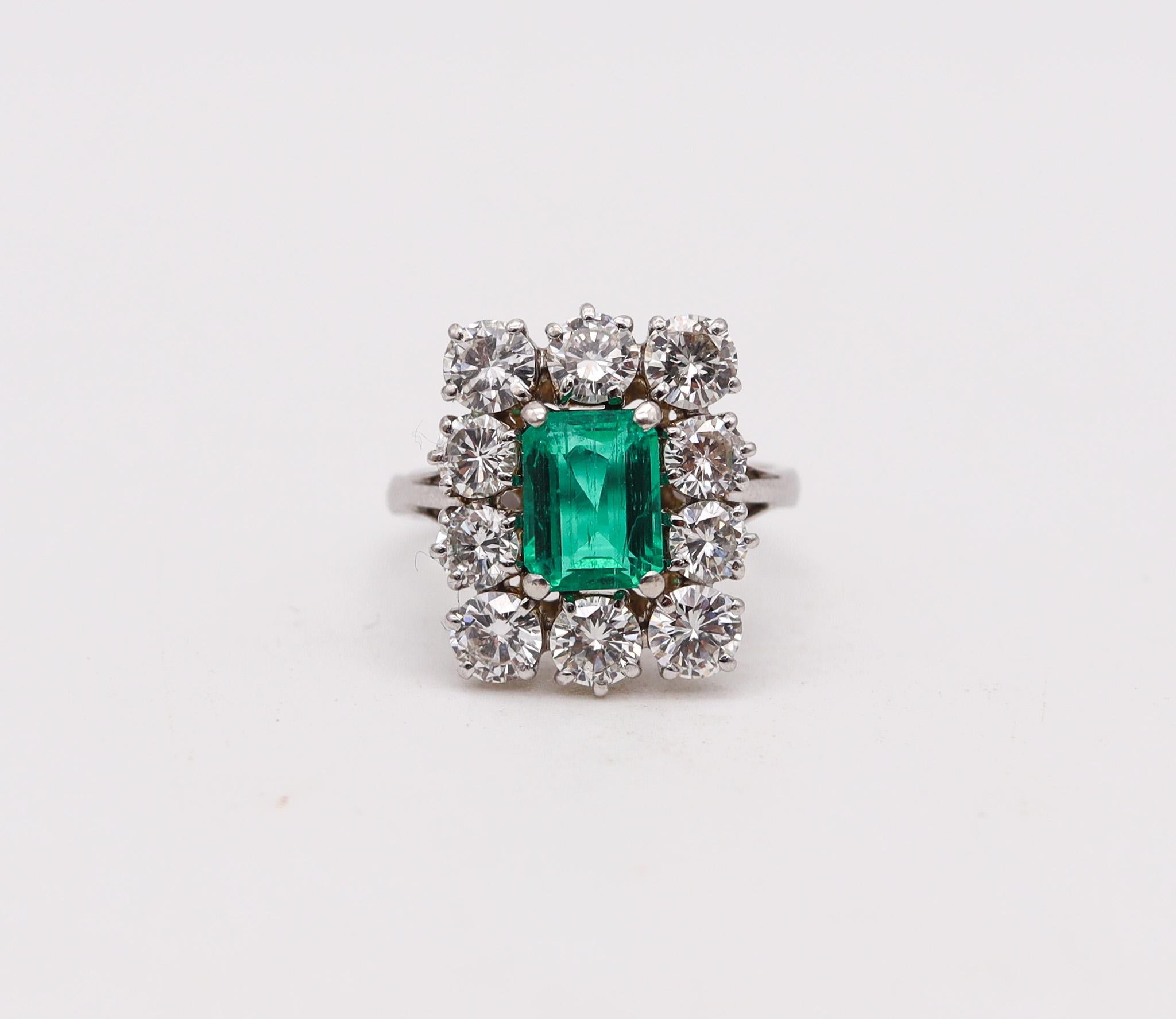 Cocktail ring with Emerald and diamonds.

Beautiful vintage cocktail ring, crafted in solid white gold of 18 karats and embellished with a terrific selection of natural earth mined gemstones. This ring has been made with a classic rectangular shape