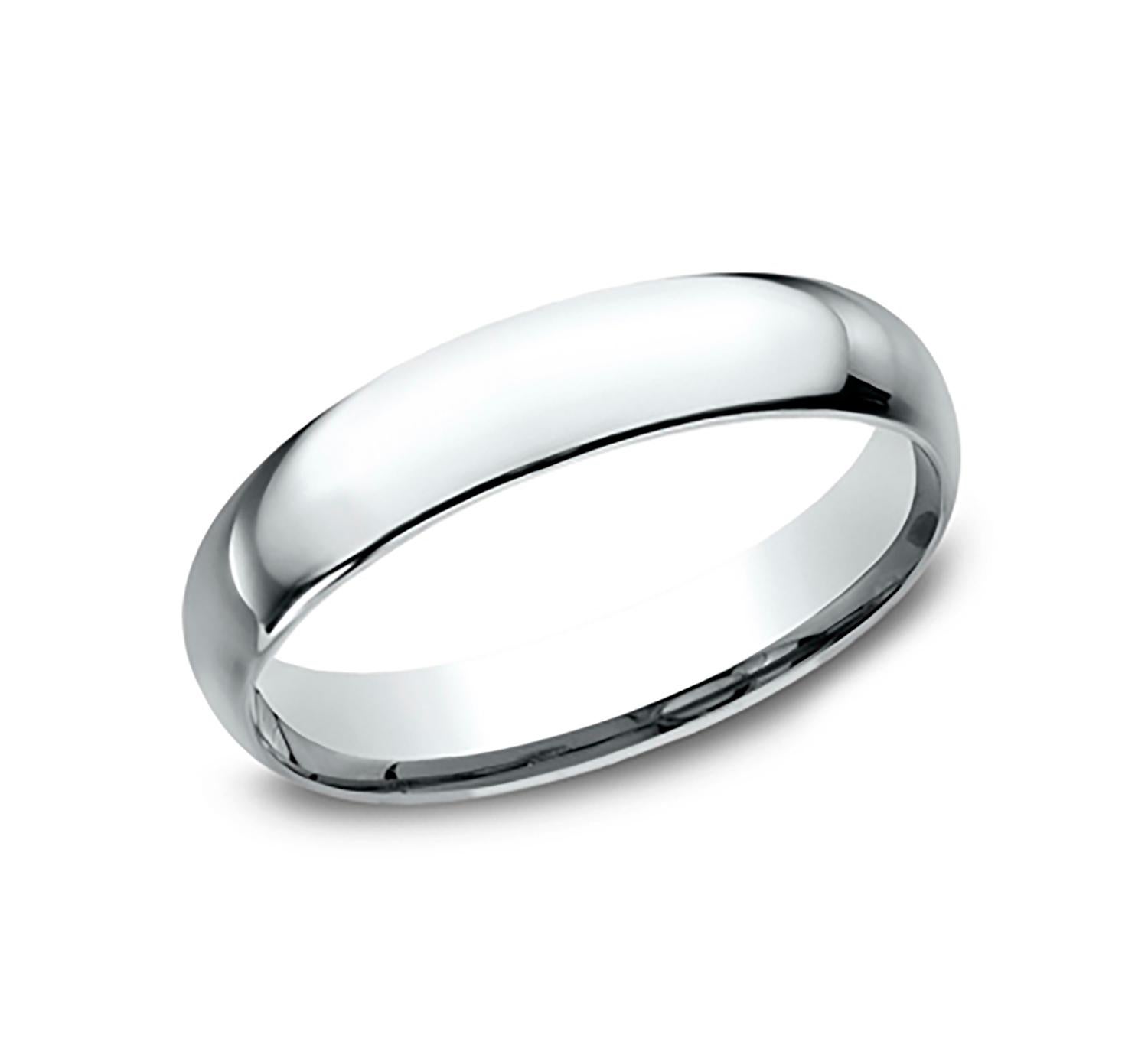Benchmark wedding band in polished platinum finish. Width 4mm, high dome comfort fit. Custom engraving and finishing available. Size 11 US and resizable upon request. Available in 1/4, 1/2, and 3/4 sizes, for more information please message us on
