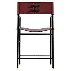 Sgabello da banco classico con. Schienale in pelle cognac e gomma nera in metallo