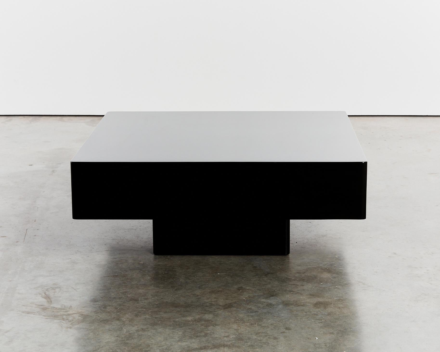Classic curved pedestal coffee table in durable black Italian lacquer.
Originally commissioned for a retail store.
Dimensions: L100 x W100 x H40cm
Condition: Subtle signs of surface wear, no scratches or chips.