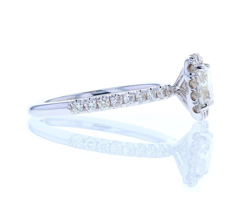This classic Classic Cushion Cut Diamond Engagement Ring With Diamond Halo is a crowd favorite. Featuring a cushion center with a cushion shaped diamond halo surrounding the center, this head-on-shank style diamond engagement ring has diamond pave