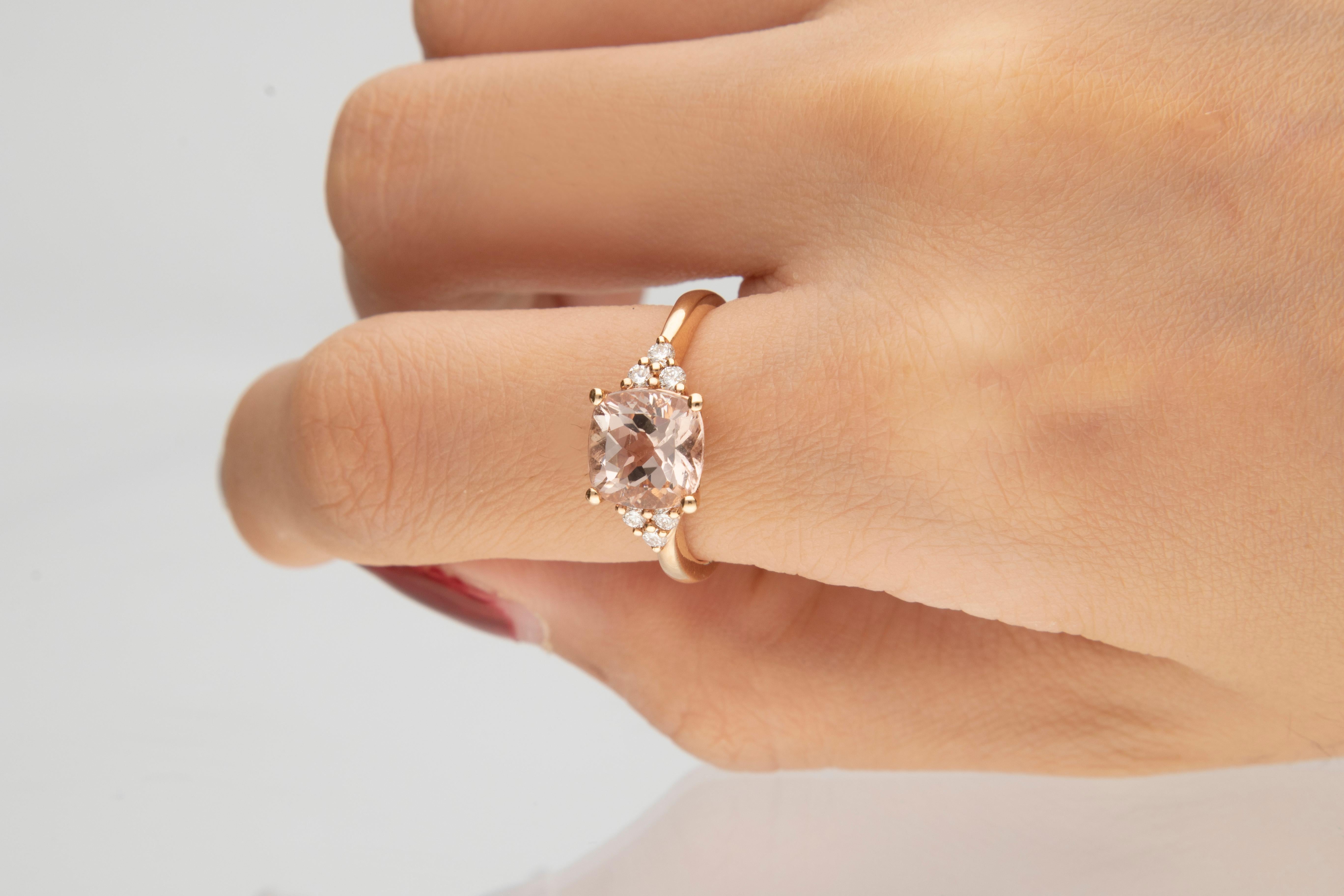 This beautiful Morganite ring is crafted in 14-karat Rose gold and features a 2.04 carat Genuine Morganite, 6 Cushion-cut White Diamonds in GH- I1 quality with 6 Pcs 0.16 cts in prong-setting. This ring comes in sizes 6 to 9, and it is a perfect