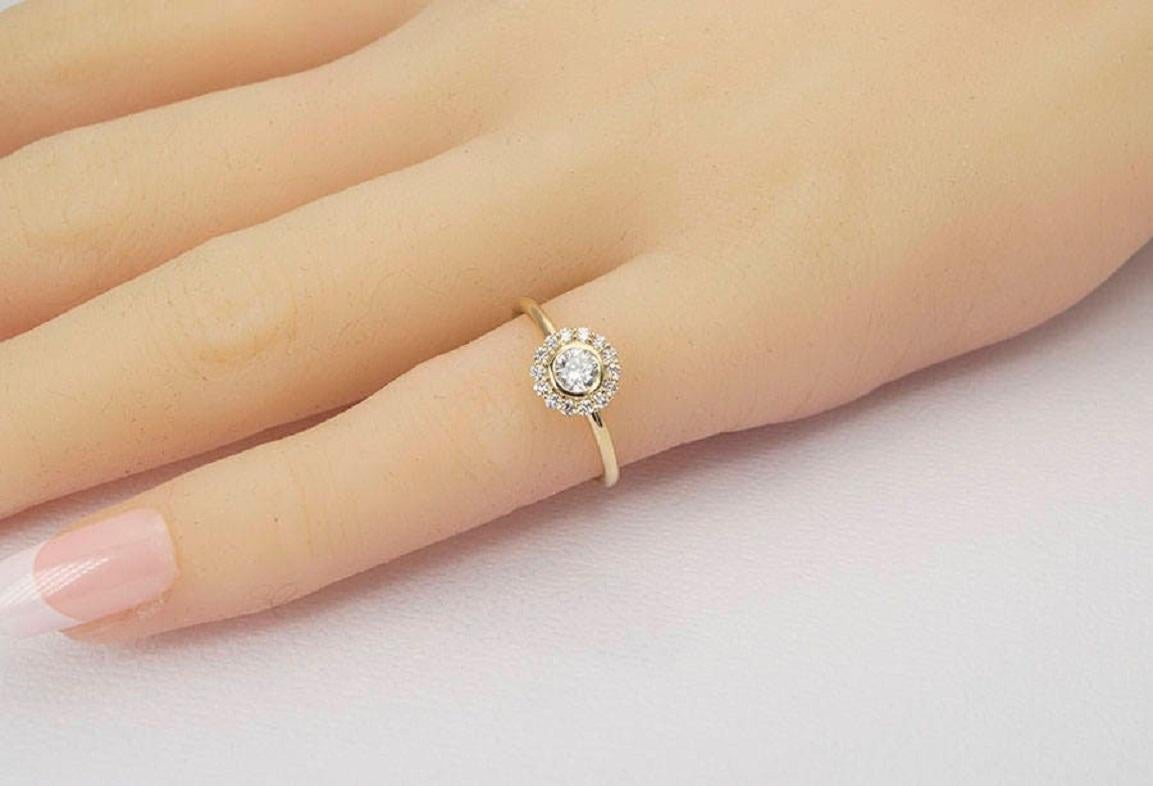 dainty round engagement rings