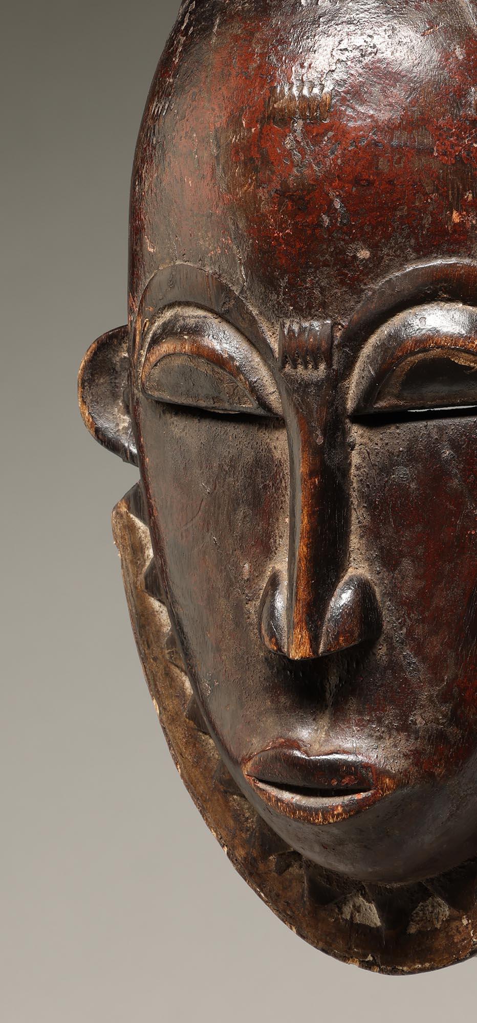 Hand-Carved Classic Danced Deep Red-Black Baule mask, Ivory Coast, Africa, mid 20th century For Sale