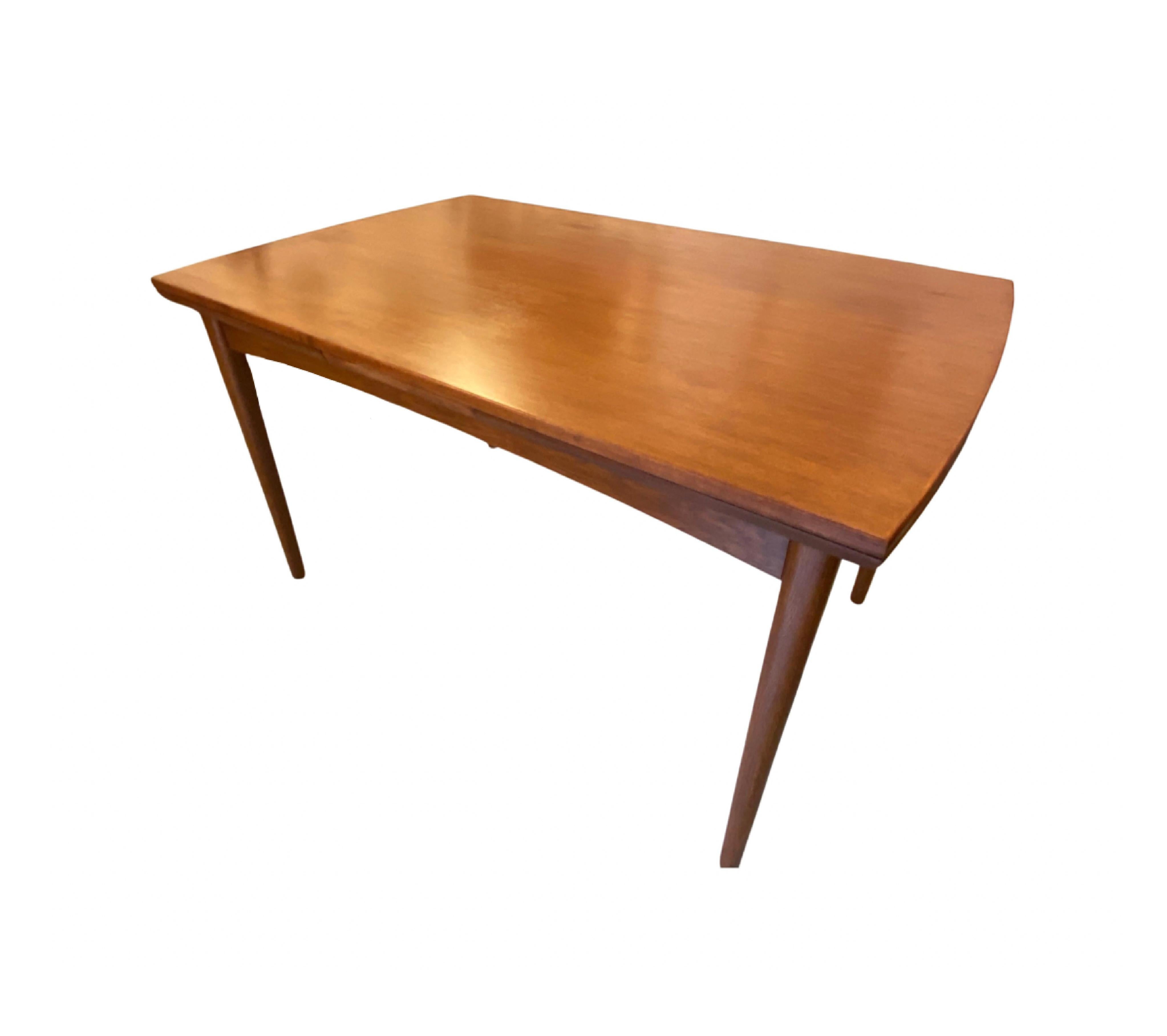 Beautiful and classic Danish mid-century dining table in teak with Dutch extensions.

With extensions the tables is 229 cm.

We have gently restored the table to the absolute highest standard while keeping its original style and appearance.  