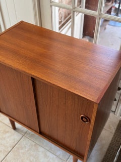 Classic Danish mid century modern teak record cabinet with sliding doors