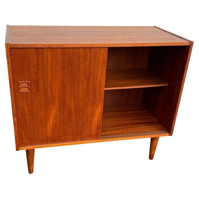 Beautiful and elegant sideboard with sliding doors.

Made by Danish furniture manufacturer in the 1960s. Teak

We have gently restored the sideboard to the absolute highest standard while keeping its original style and appearance.  