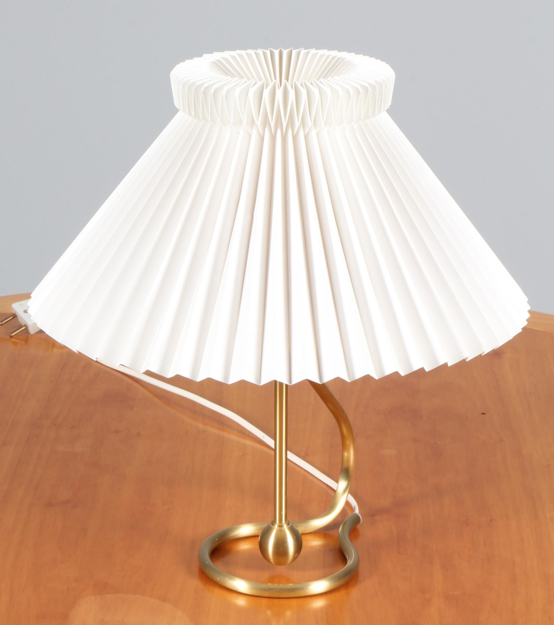 The grand father of Danish design Kaare Klint designed this beautiful brass lamp in 1945 and added a functionality to the lamp that hasn't been seen before at that time: The lamp could be tilted in different positions and even be used as a wall