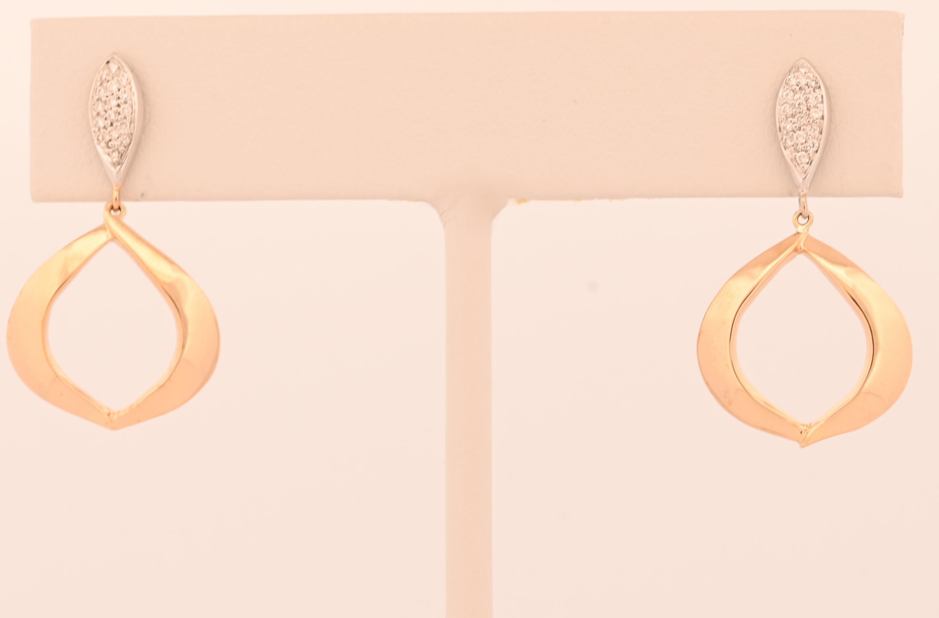 Elevate your style with our Soleil East Earrings, a striking fusion of contemporary design and classic elegance. Featuring a sleek, elongated silhouette, these earrings are adorned with sparkling diamonds creating a stunning play of light. The