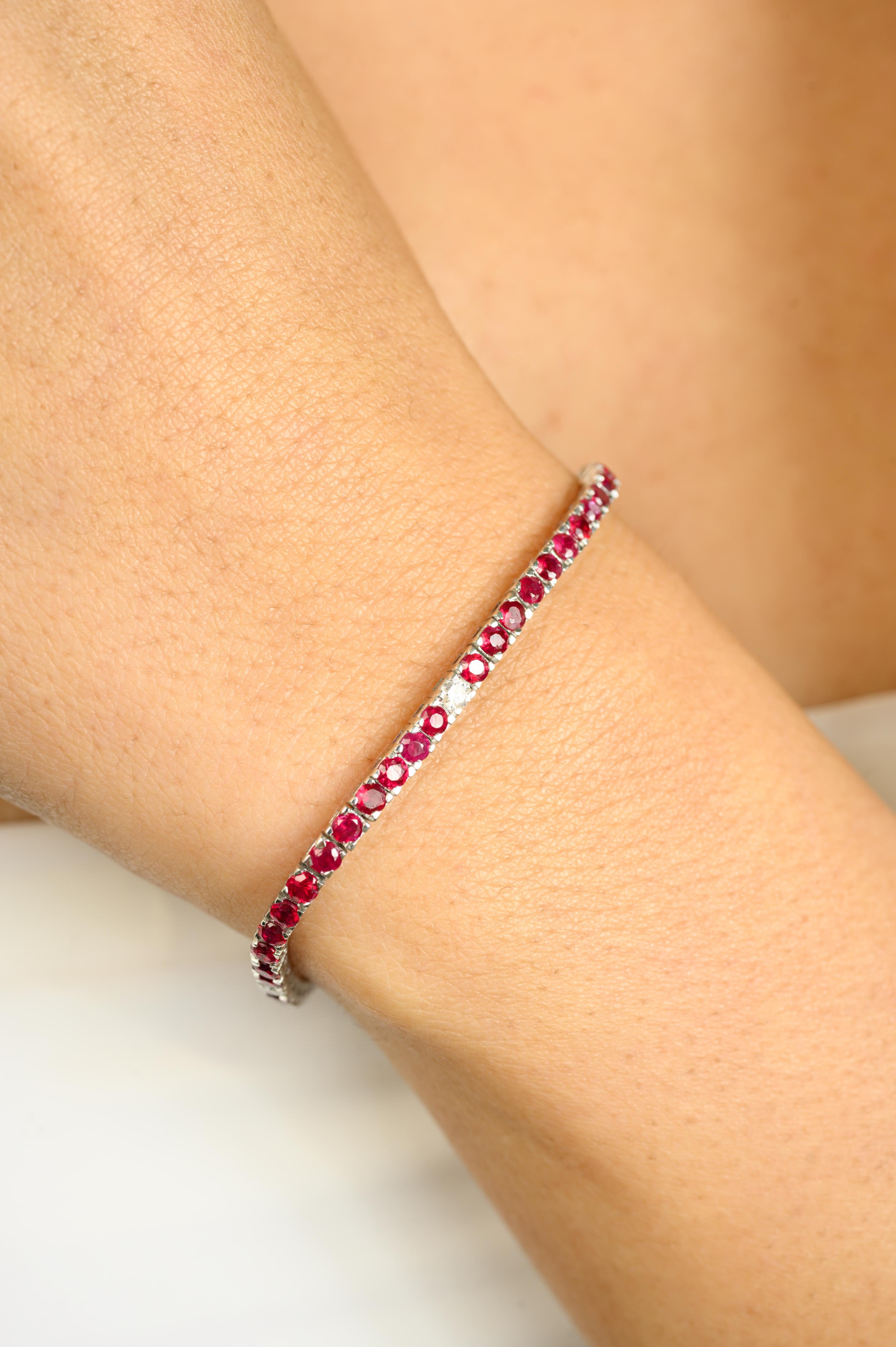 This Classic Design Ruby and Diamond Engagement Tennis Bracelet in 14k White Gold showcases endlessly sparkling natural ruby, weighing 4.76 carats and diamonds weighing 0.34 carats. It measures 7 inches long in length. 
Ruby improves mental