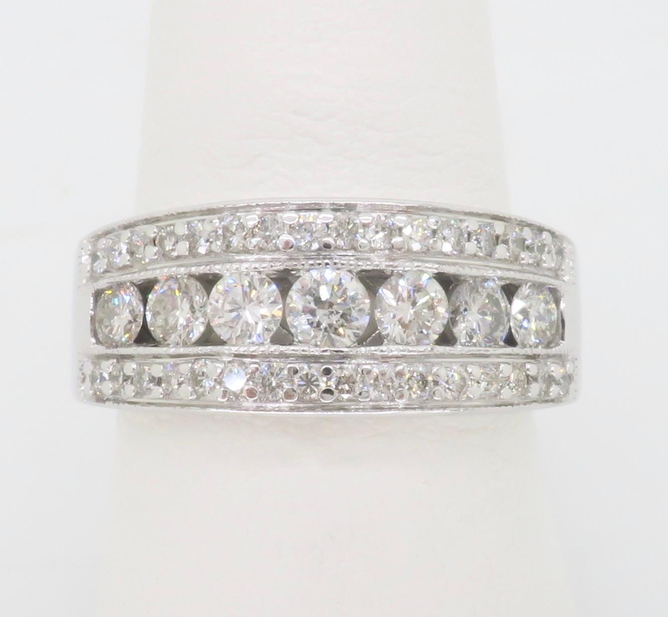 Three-row diamond band made with 1.10ctw of Round Brilliant cut diamonds. 

Diamond Cut: Round Brilliant 
Total Diamond Carat Weight: Approximately 1.10CTW
Average Diamond Color: F-I
Average Diamond Clarity: SI1-I1
Metal: 14k White Gold
Ring Size: 7