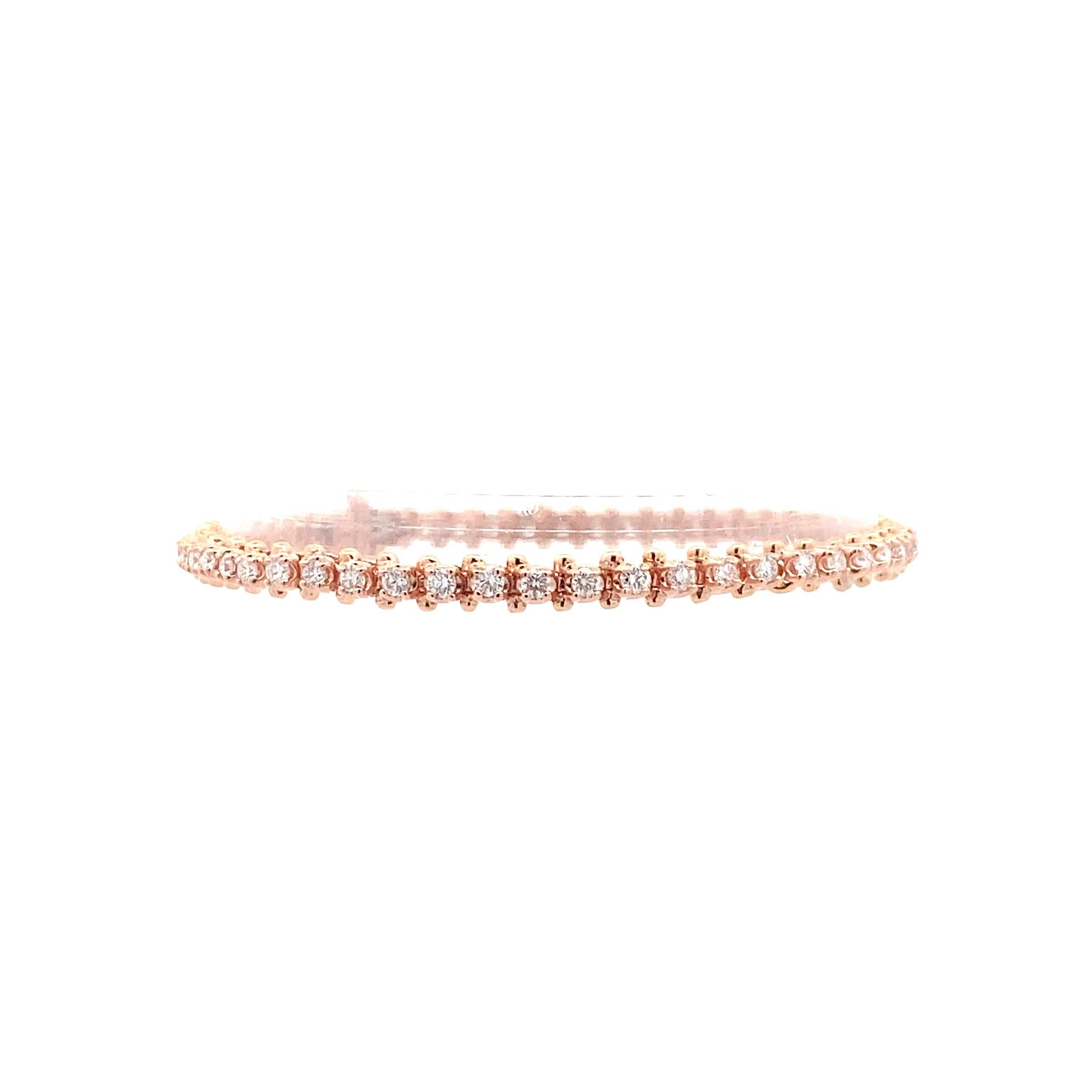 This exquisite 14k rose gold bracelet exudes a timeless elegance with its classic and traditional design. Adorned with a breathtaking 1.92 carat white round diamond, this piece radiates sophistication and luxury. The brilliance of the diamond is