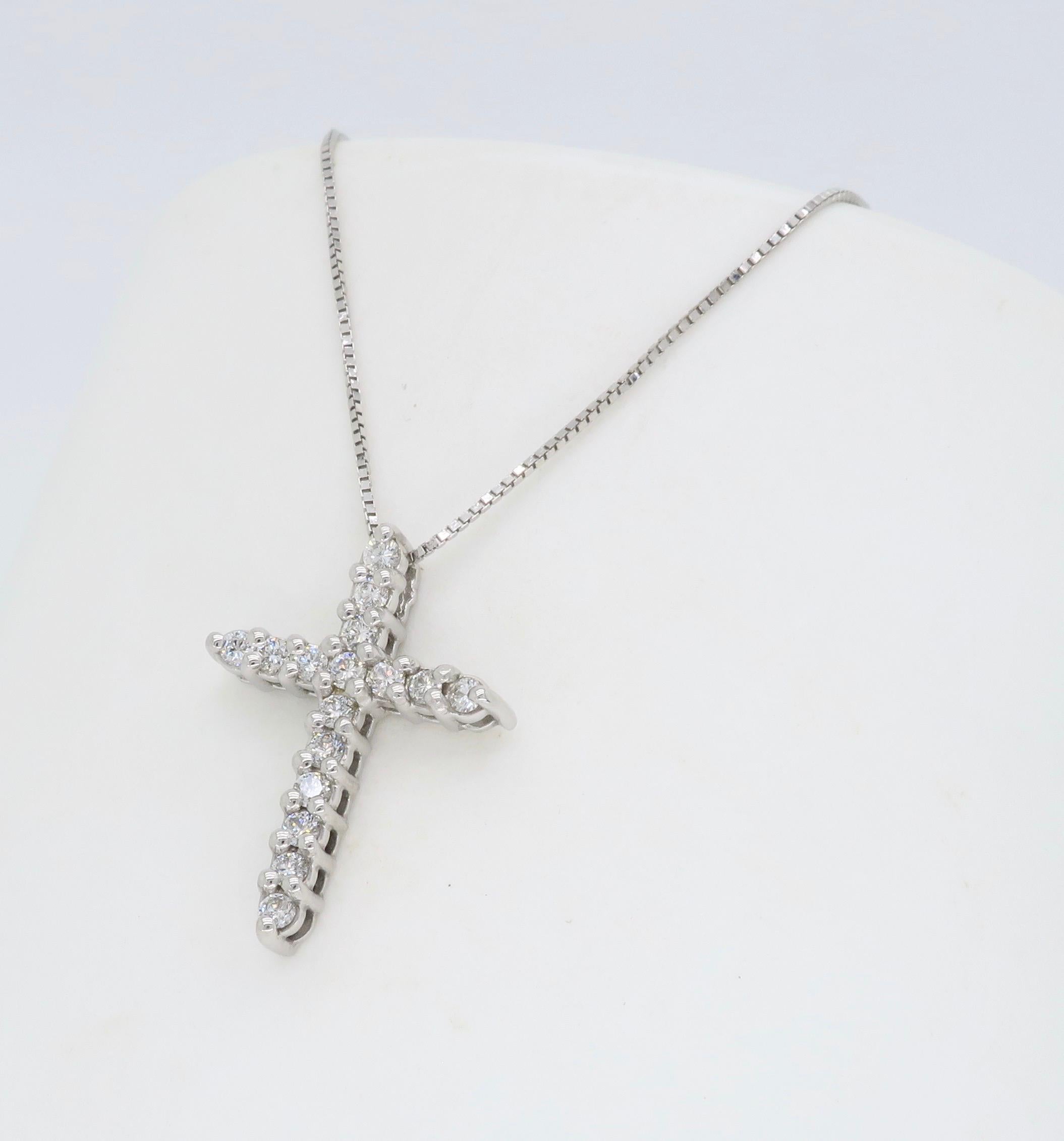 Approximately .25CTW diamond cross pendant necklace crafted in 14k white gold.

Diamond Carat Weight: Approximately .25CTW
Diamond Cut: Round Brilliant Cut Diamonds
Color: Average G-J
Clarity: Average SI-I
Metal: 14K White Gold
Marked/Tested: Tested