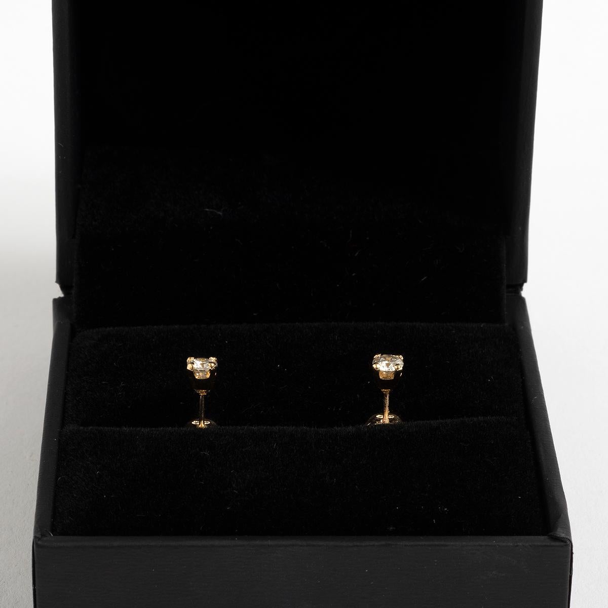 Our classic diamond ear studs in 9k yellow gold feature diamond solitaires of est. .30ct