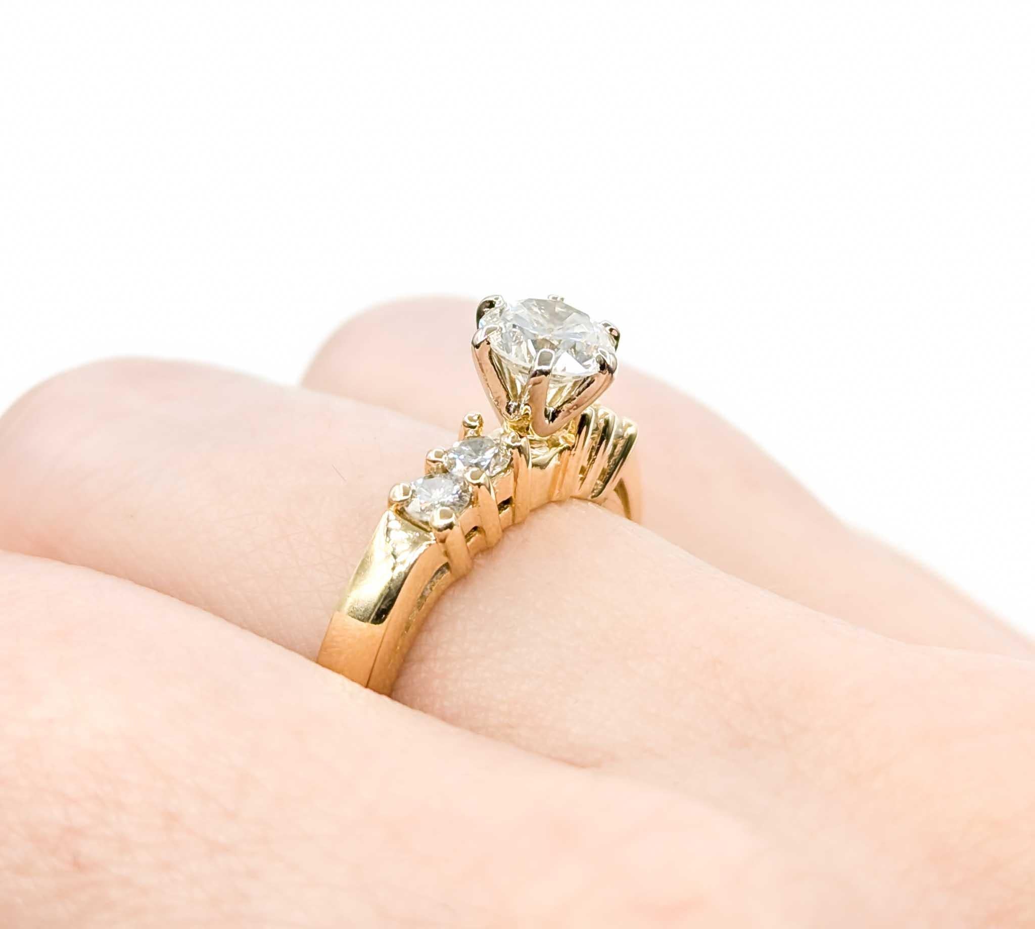 Classic Diamond Engagement Ring in 14k Yellow Gold

Introducing this timeless engagement ring crafted in 14k yellow gold. The ring features a .73ct diamond accented by .32ctw diamonds. The sparkly .73ct diamond is SI clarity with a near-colorless