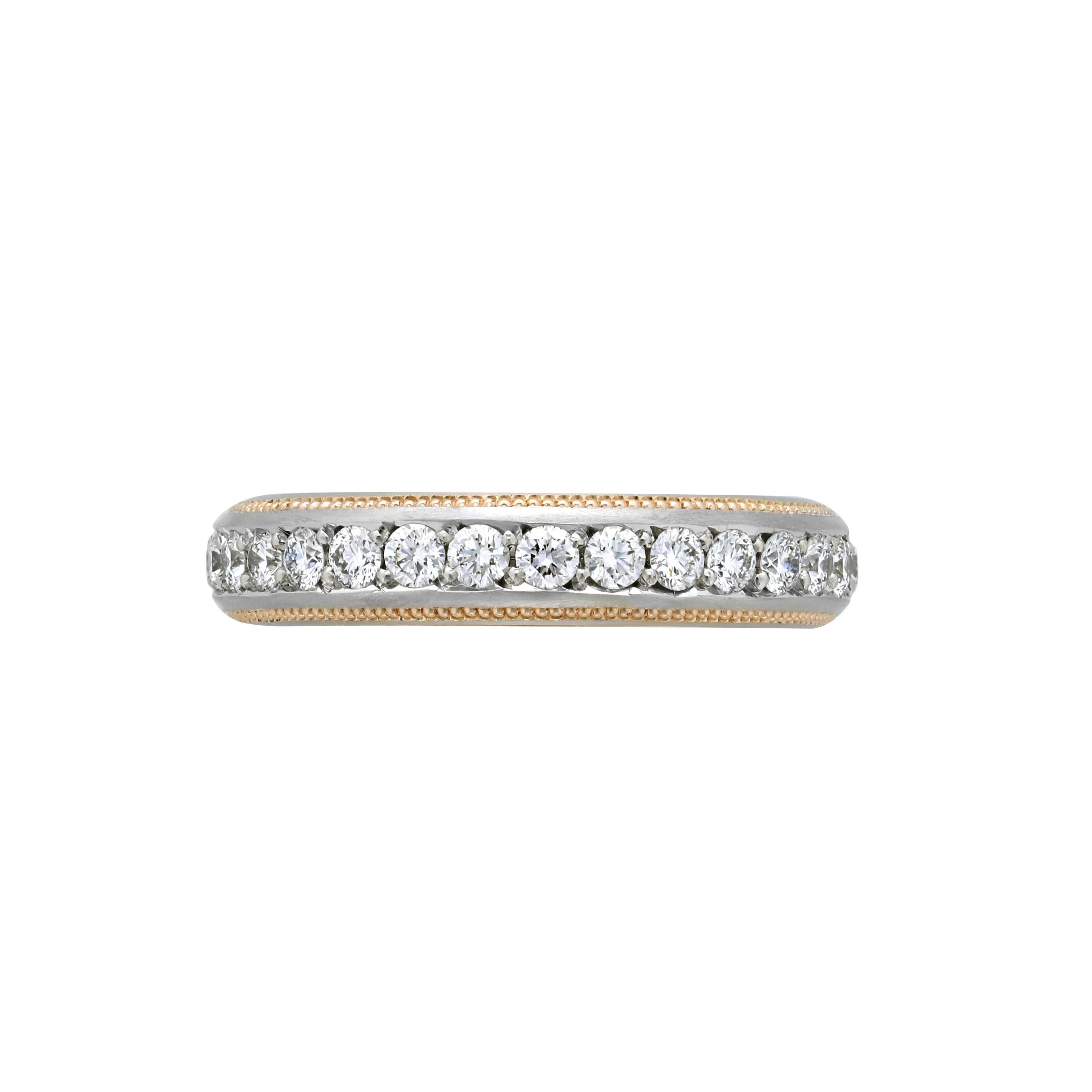 Classic Diamond eternity band with the Zoltan David flair - two lines of 20K Rose Gold on each side of the round brilliant Diamonds and a Rose Gold inner sleeve. .87 ct. total of DEF color / Internally Flawless to VVS clarity Ideal cut Diamonds.