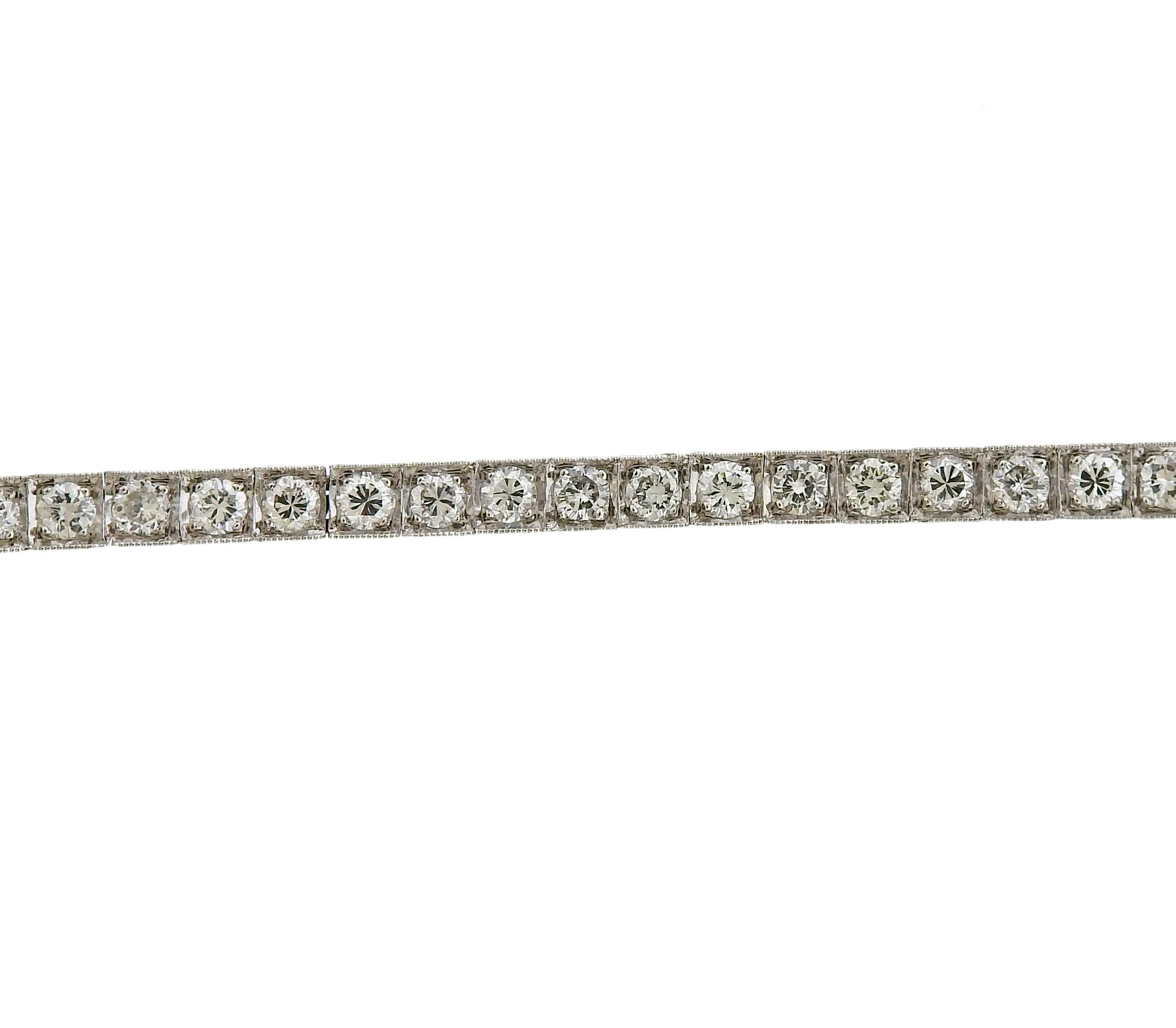 18k white gold classic tennis line bracelet, featuring approximately 3.80ctw in diamonds. Marked 750, the bracelet weighs 12.7 grams. Length of the bracelet is 6 7/8
