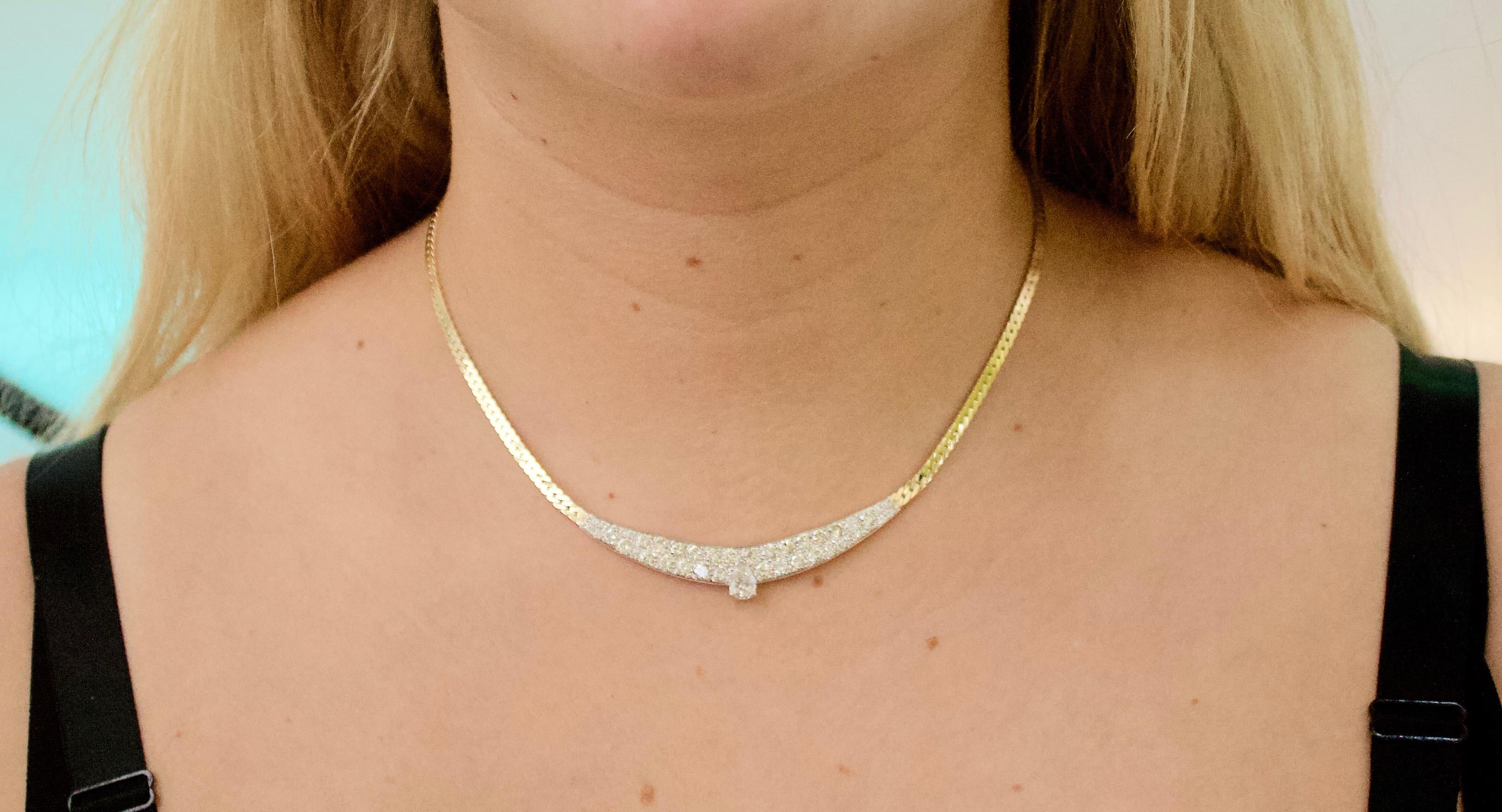 Classic Diamond Necklace in White and Yellow Gold Circa 1960's 3.55 Total Carats
One Pair Shape Cut Diamond Weighing .60 Carats Approximately [GHI- SI3] [bright with no imperfections visible to the naked eye]
40 Round Brilliant Cut Diamonds Weighing