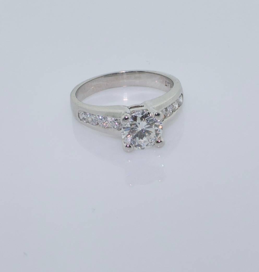 Classic Diamond Solitaire Ring in Platinum 1.03 GIA F-VS2 
Eight Round Brilliant Cut Diamonds weighing .35 carats approximately
Size 6. It can be easily sized
