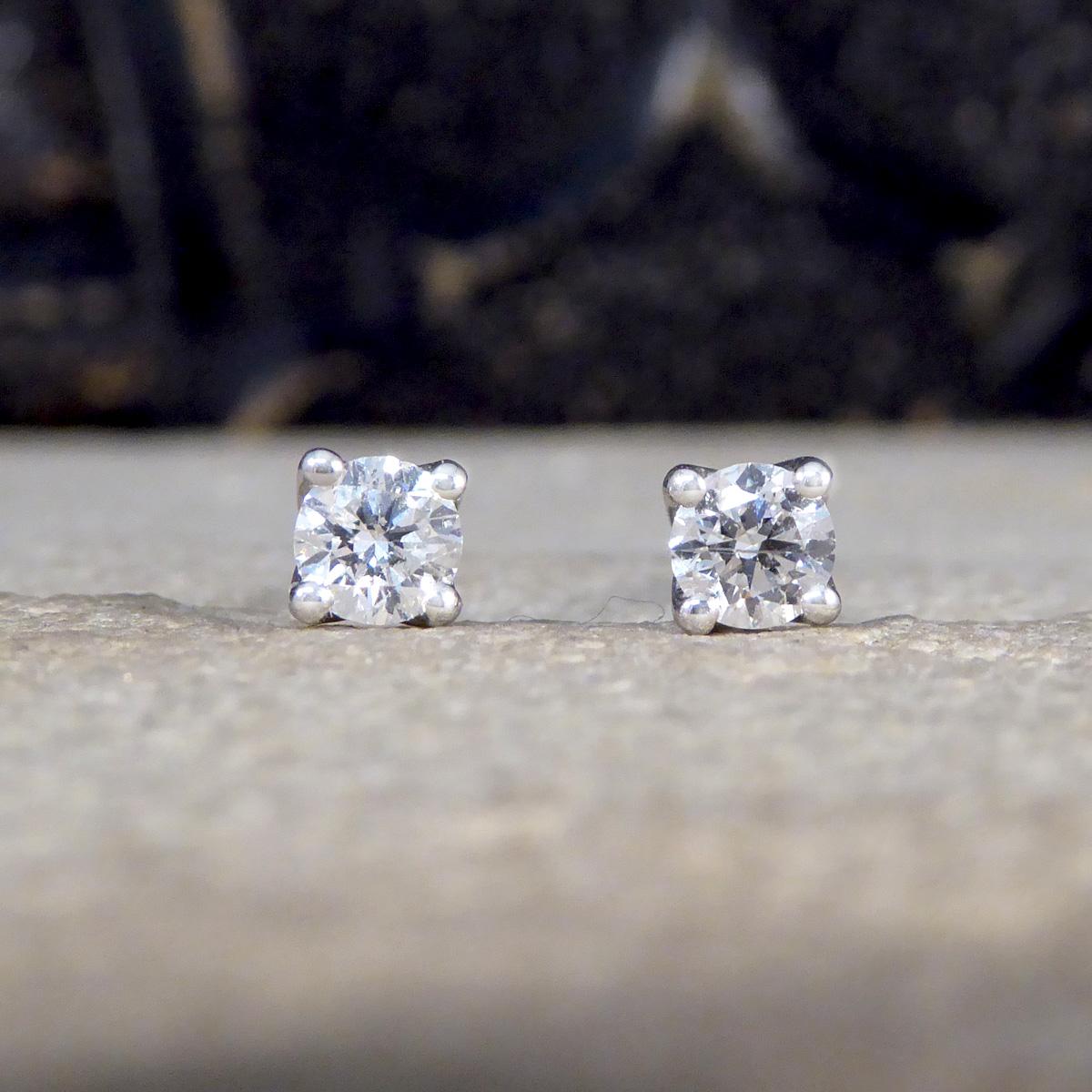 The perfect pair of stud earrings for everyday wear. Each stud is set with a Round Brilliant Cut Diamond, matching well in colour and clarity and weighing a total of 0.40ct. Each Diamond sits in a 18ct White Gold four claw curtain style open