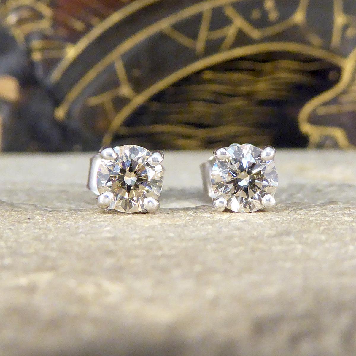 The perfect pair of stud earrings. Each stud is set with a Round Brilliant Cut Diamond, matching well in colour and clarity and weighing a total of 0.97ct. The Diamonds are very clear with with only one very slight inclusion on the outer of one