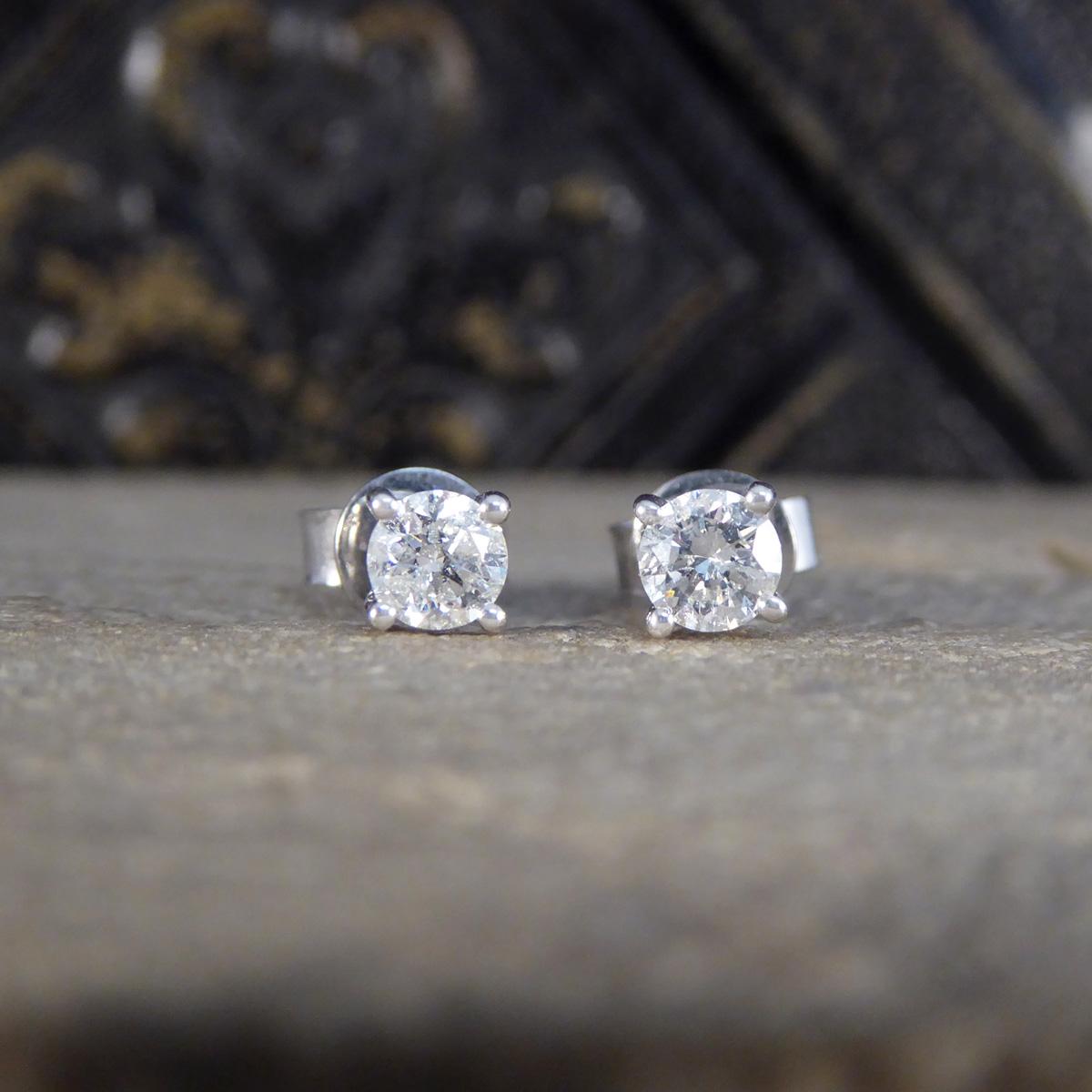The perfect pair of stud earrings for everyday wear. Each stud is set with a Round Brilliant Cut Diamond, matching well in colour and clarity and weighing a total of 0.58ct. Each Diamond sits in a 18ct White Gold four claw bow style open setting,