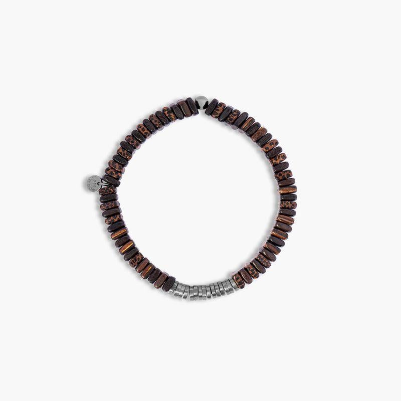 Classic Discs Bracelet in Ebony Wood, Size M

A staple piece of the Tateossian collection gets an upgrade with this black rhodium finish. This is the perfect addition to your stack, and comes in a range of meaningful semi-precious stone combinations