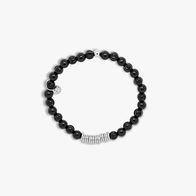 Classic Discs bracelet with black agate and sterling silver, Size L

Black agate beads are paired with hand-polished, rhodium-plated sterling silver discs, crafted in our Imperial Wharf, central London workshop. Designed onto a closed elastic which