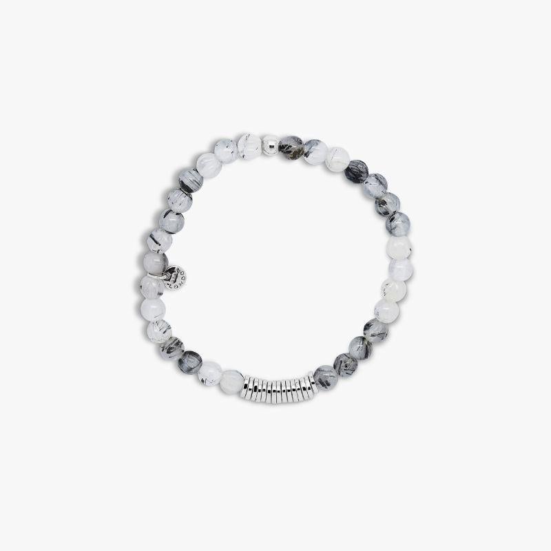 Classic Discs bracelet with black rutilated quartz and sterling silver, Size L

Rutilated quartz beads are paired with hand-polished, rhodium-plated sterling silver discs, crafted in our Imperial Wharf, central London workshop. Designed onto a