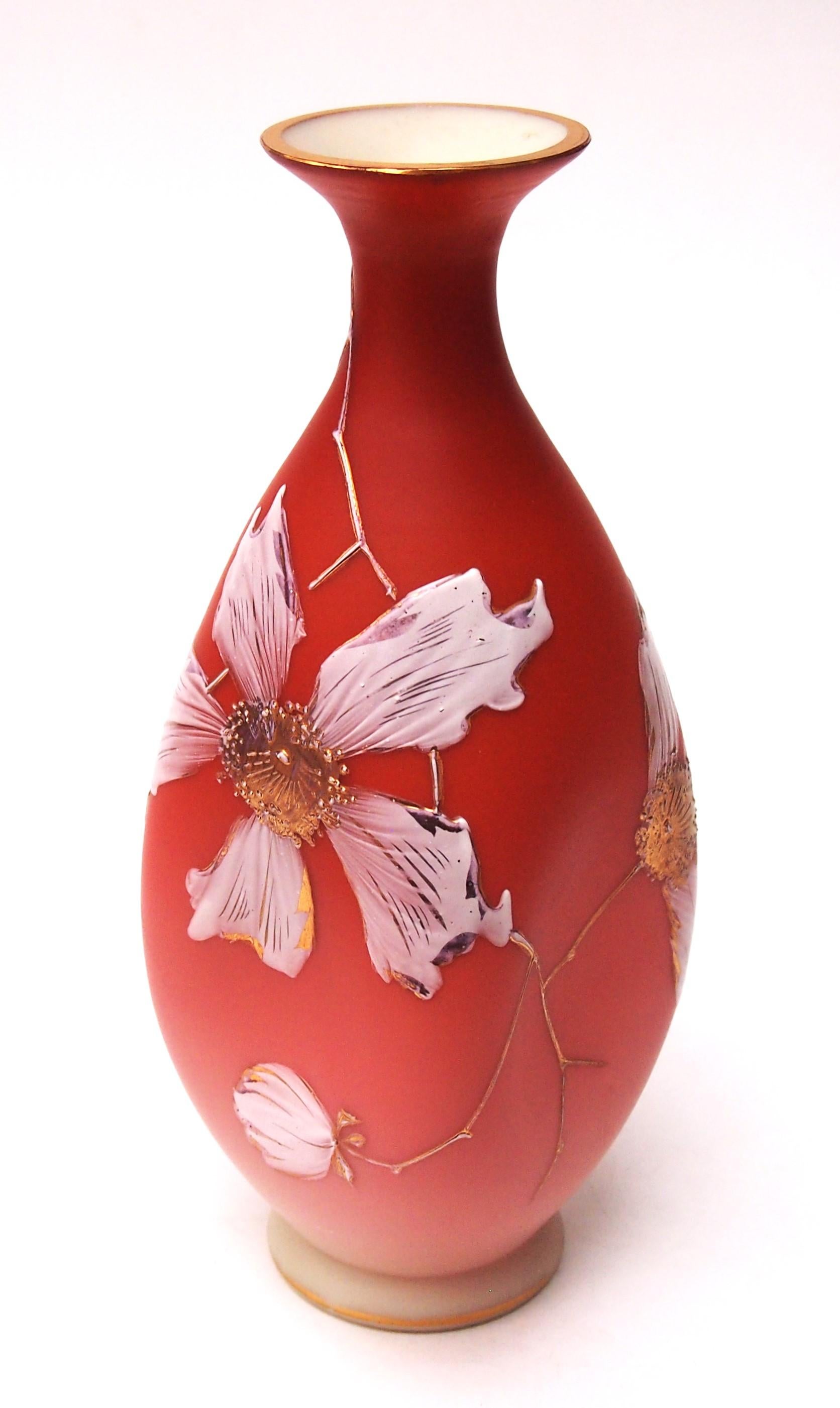Classic early Loetz glass vase enamalled with white and gilded large blossomed dogwood on peach at the top spreading to white below made a pattern recently discovered to be called Sphinx made in 1891. A tall necked vase  initially blown circular but
