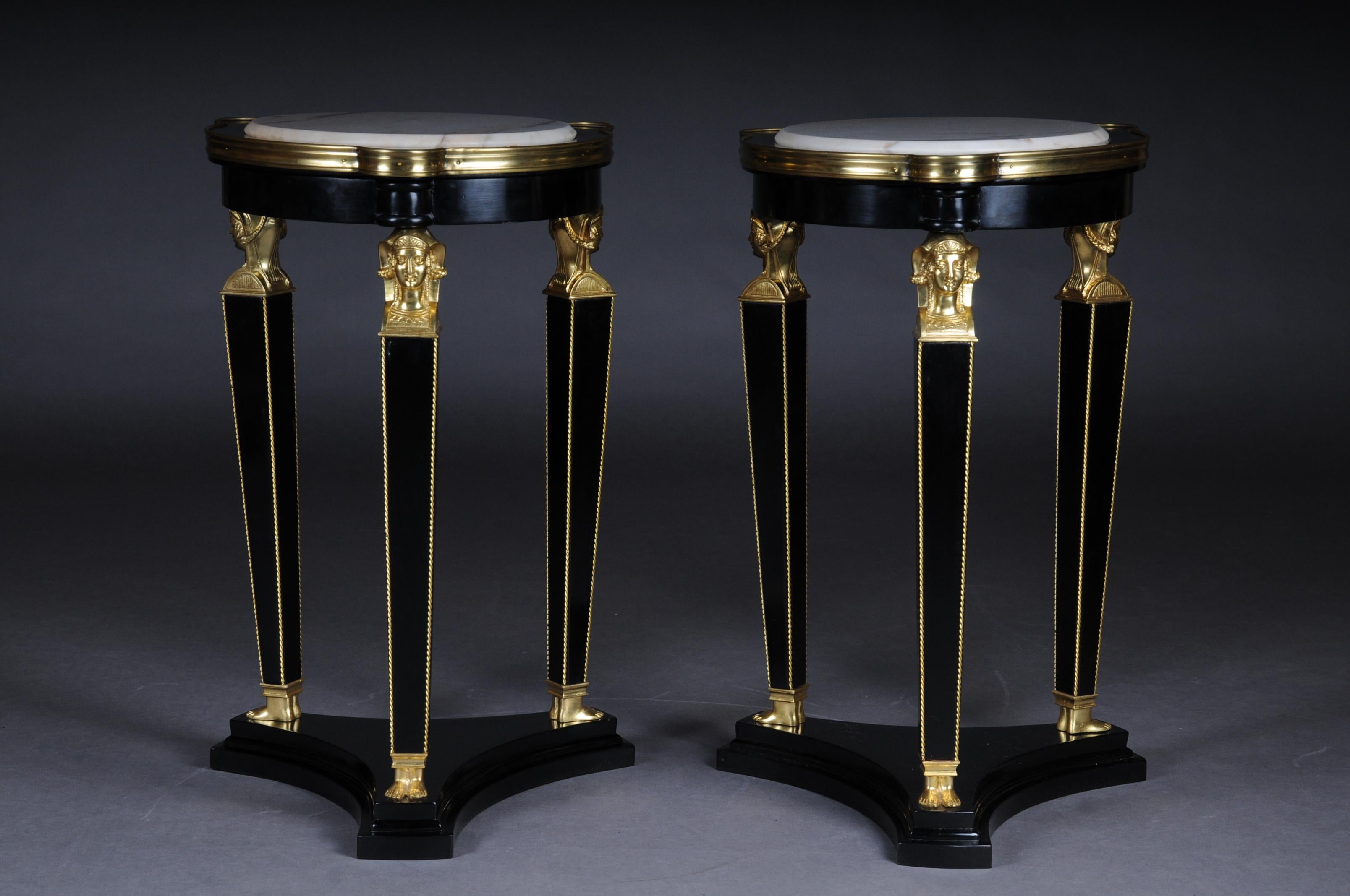 Piano black polished veneer on solid wood. Round body with marble slab on Karyadites with tapering square legs in sabots ending on three sided recessed base plate. The fittings are pronounced and of exceptionally good quality. Beautiful patina, with