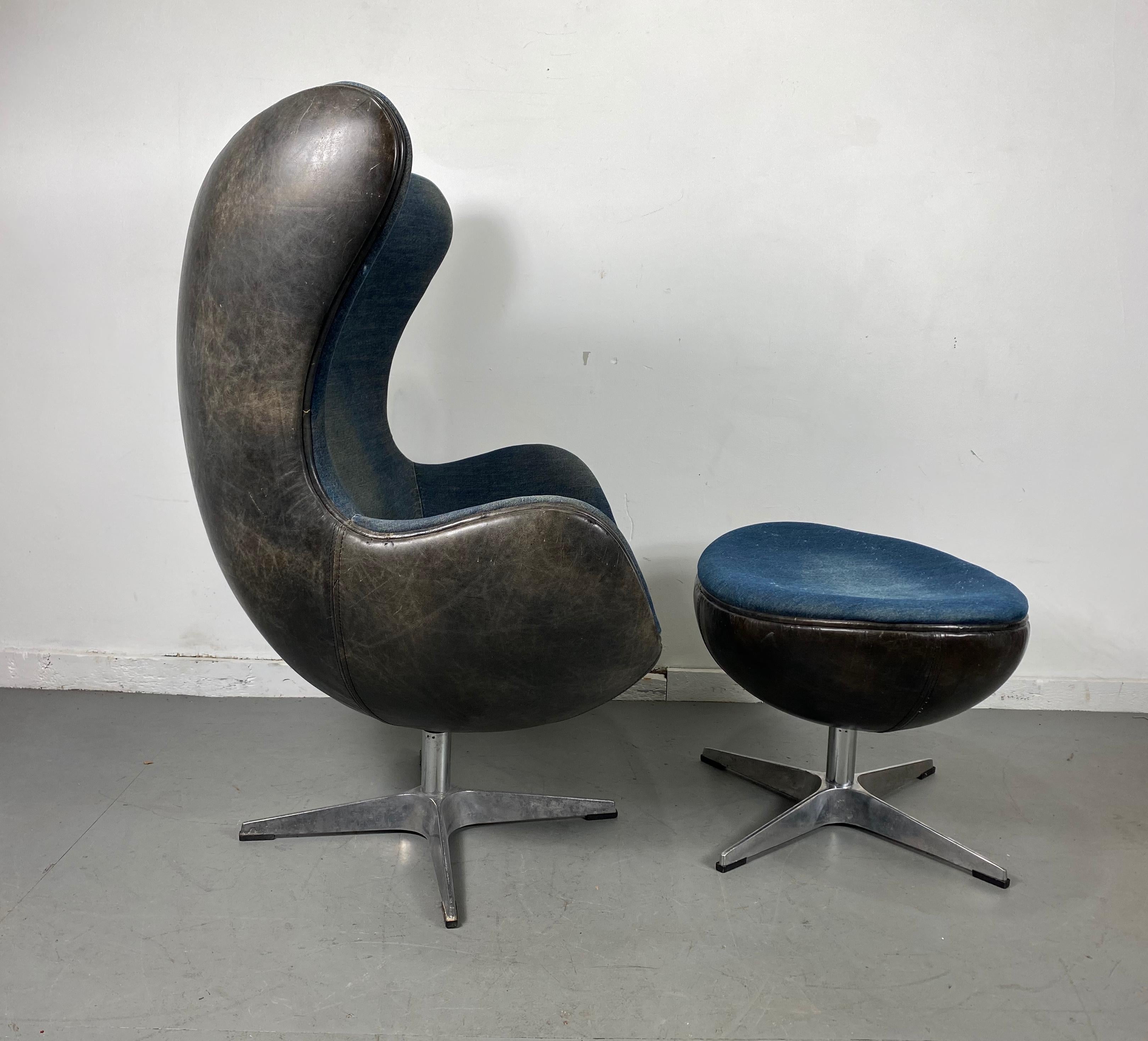 Classic egg chair and ottoman, black leather and denim. after Arne Jacobsen, vintage egg and ottoman, circa 1980s, beautifully worn thick black leather shell, denim interior and top of ottoman, aluminum bases in ruff condition, have not polished /