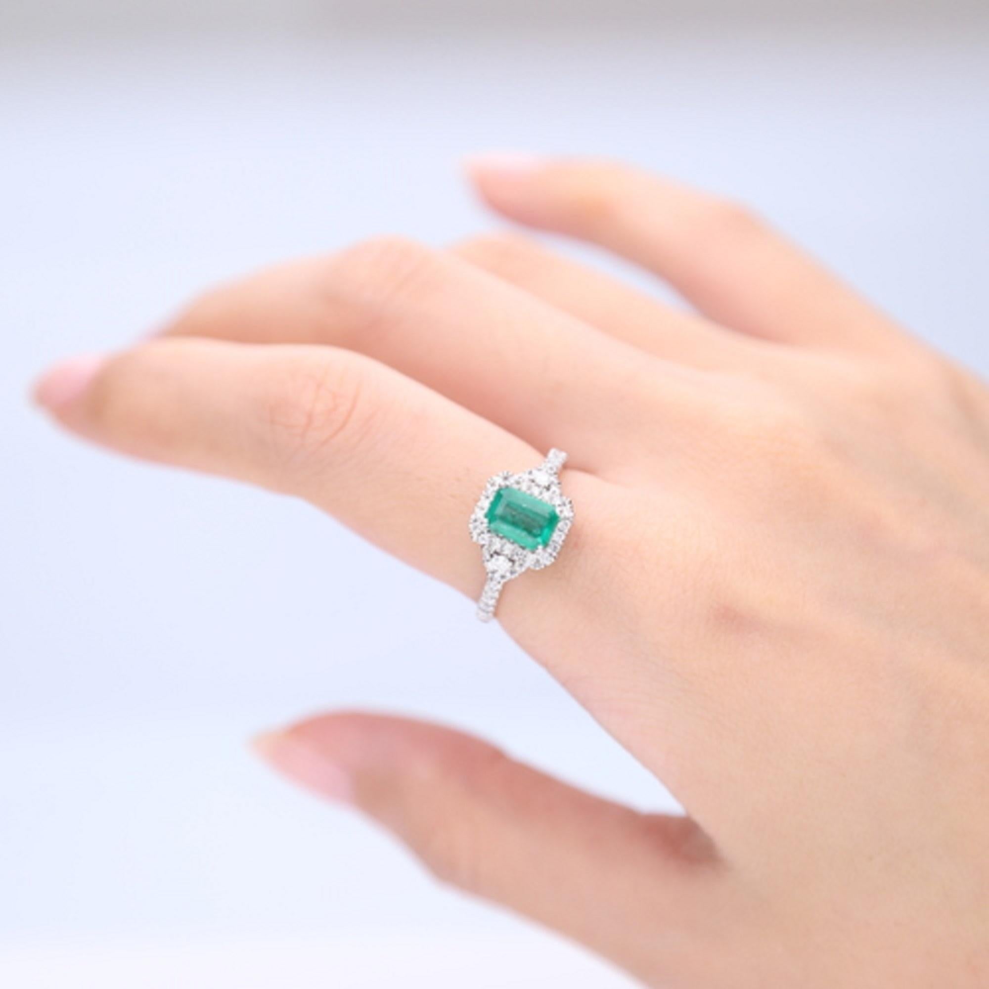 Stunning, timeless and classy eternity Unique Ring. Decorate yourself in luxury with this Gin & Grace Ring. The 14k White Gold jewelry boasts Emerald cut Prong Setting Natural Zambian Emerald (1 pcs) 0.98 Carat, along with Natural Round cut white